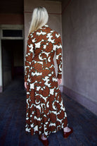 Model wearing the sophisticated patterned Hera dress by Cara Cara with a flattering A-line silhouette