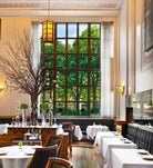 Image showing the interior of Eleven Madison Park restaurant on the left and the front cover of 'The Cookbook