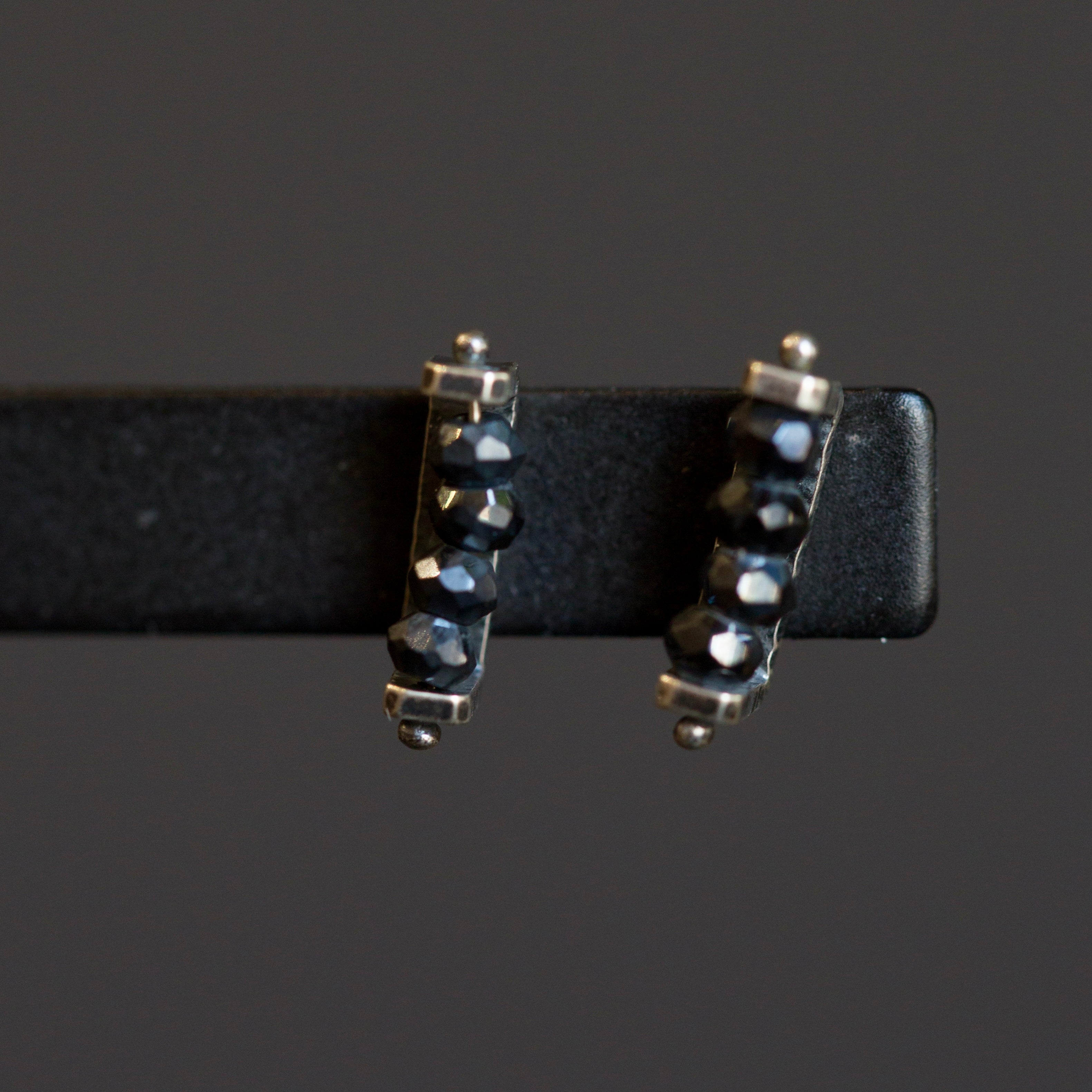 Image of sterling silver and black spinel linear Stud Earrings from fine jewelry artist Erica Bailey hand crafted in USA