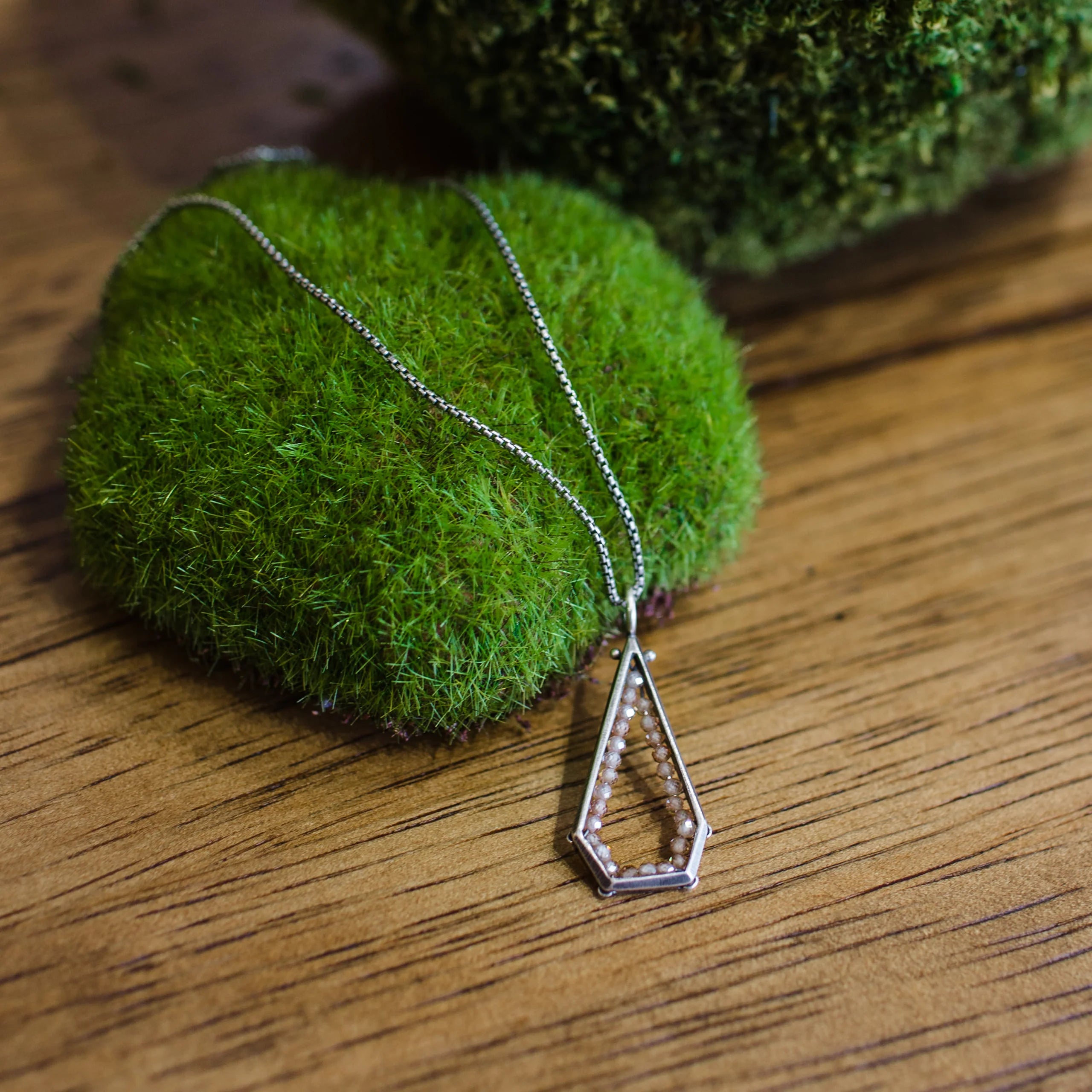 Image of a sterling silver and champagne zircon geometric hexagon pendant necklace by North Carolina jewelry artist Erica Bailey handmade in USA
