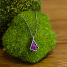 A sterling silver necklace with a red ruby pendant on an 18-inch chain, handmade in USA by Asheville artist Erica Bailey