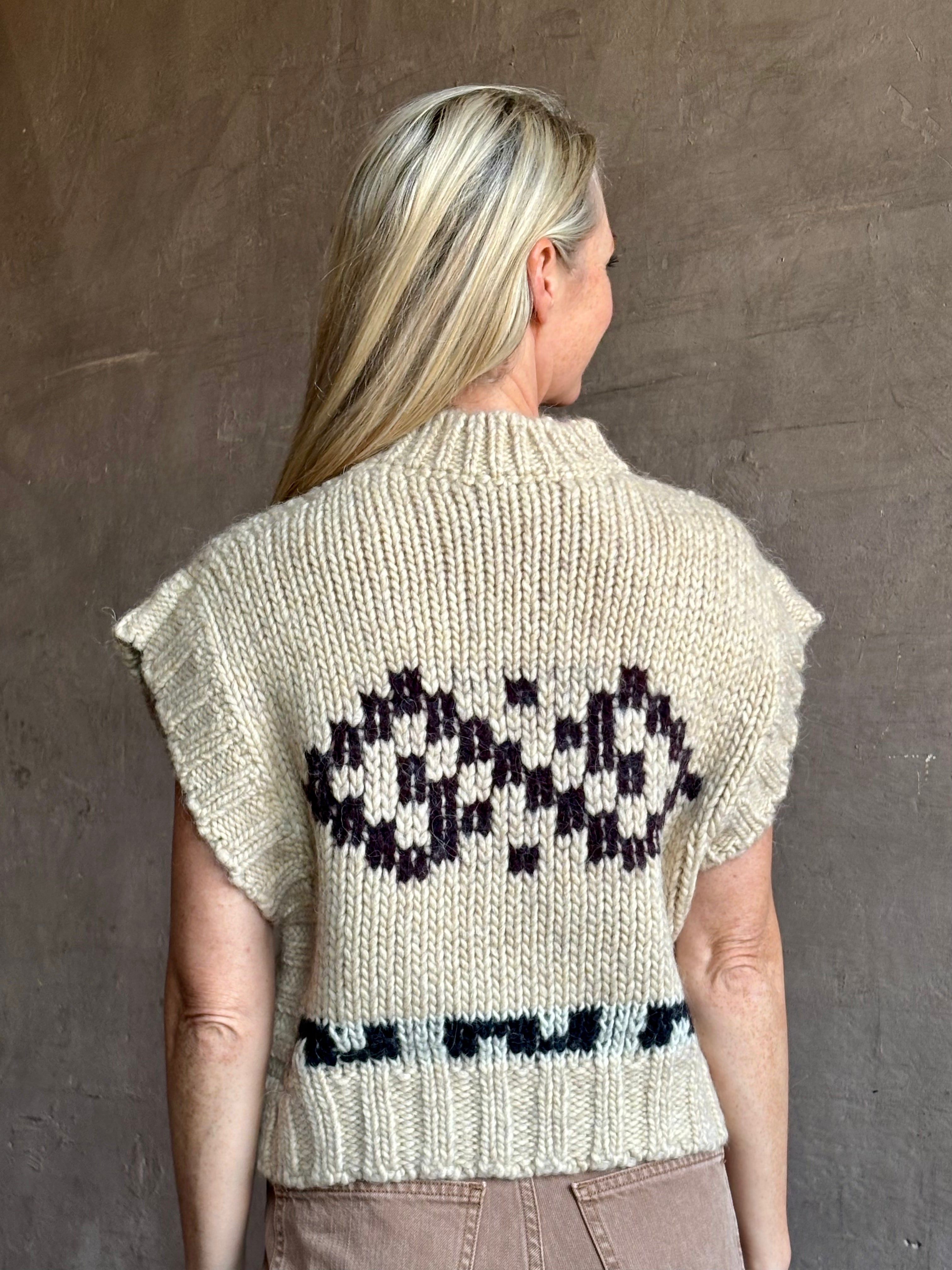 Image of mature woman wearing luxury Italian designer FORTE FORTE Attica Jacquard alpaca wool knit sweater Vest in Honey