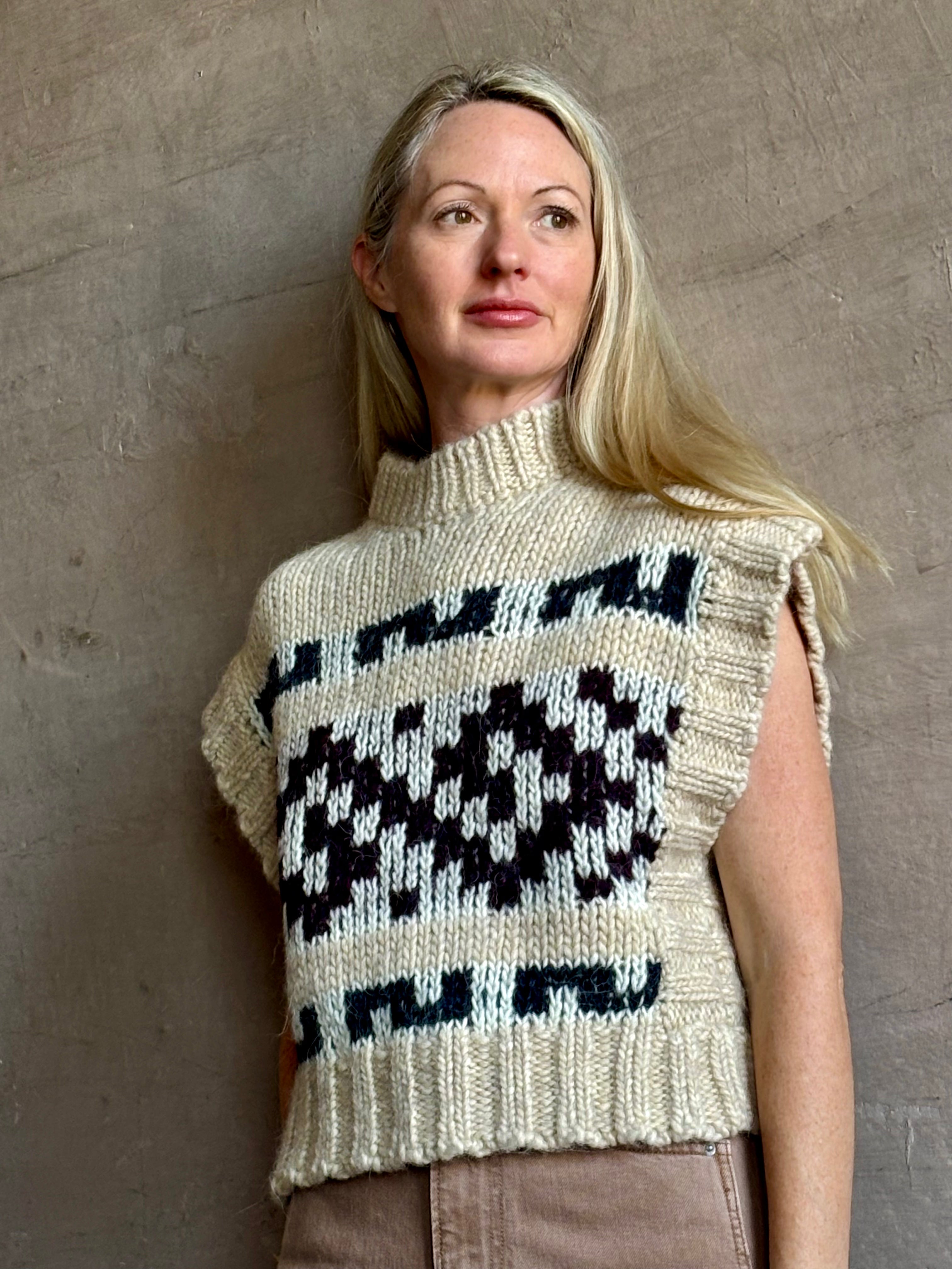 Image of mature woman wearing luxury Italian designer FORTE FORTE Attica Jacquard alpaca wool knit sweater Vest in Honey