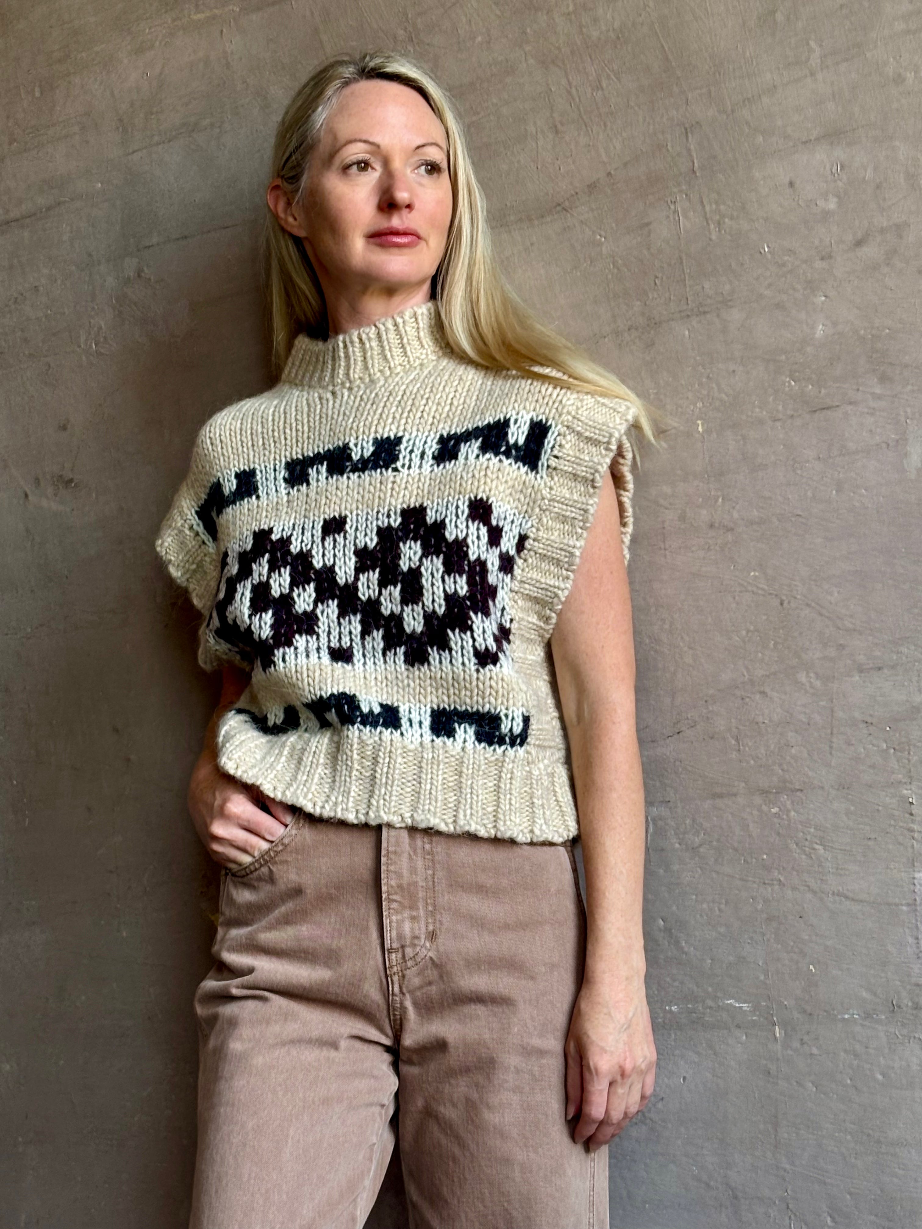 Image of mature woman wearing luxury Italian designer FORTE FORTE Attica Jacquard alpaca wool knit sweater Vest in Honey