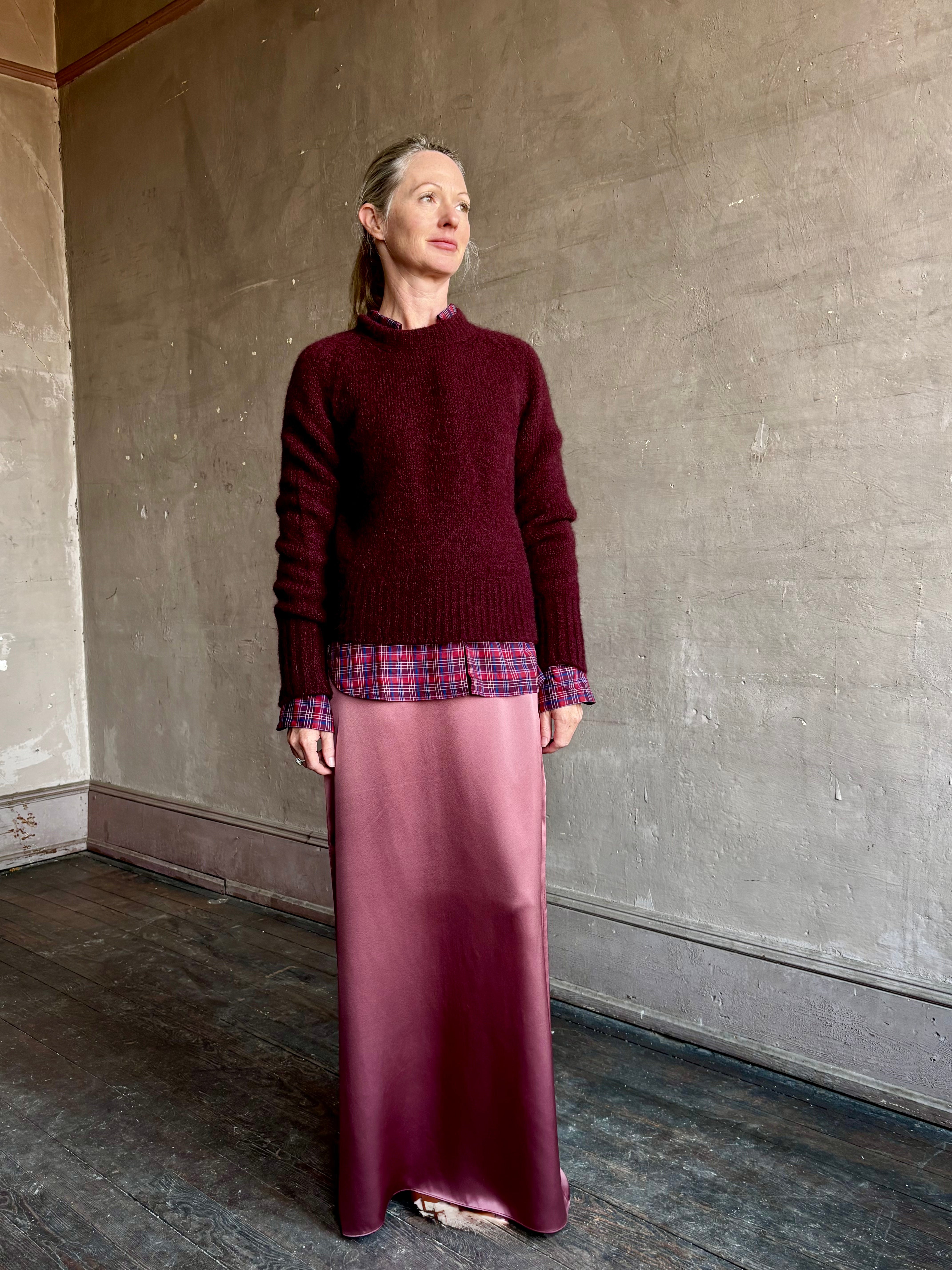 Image of mature woman wearing luxury Italian designer FORTE FORTE Round Neck long sleeve Sweater in Ruby red with Premium Italian Mohair 