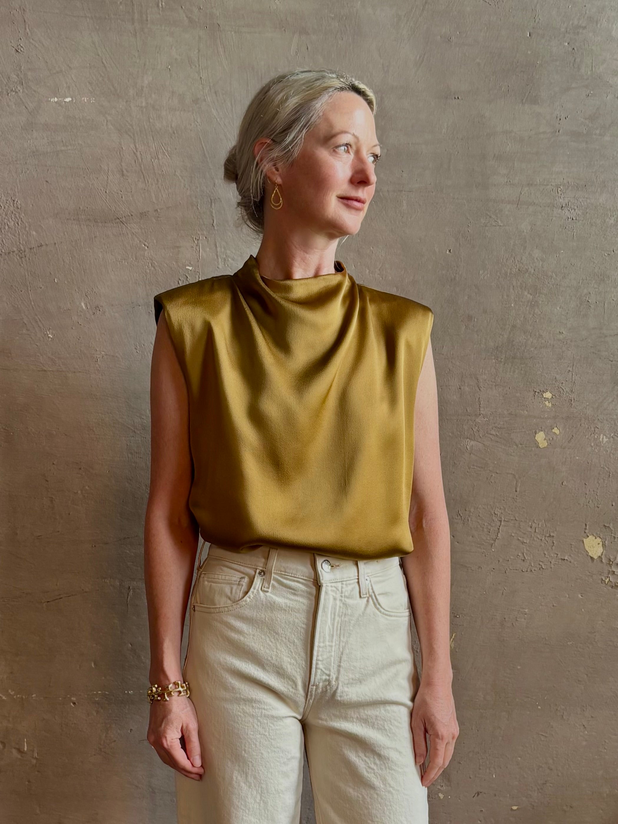 woman wearing luxury Italian designer FORTE FORTE Envers Satin Crater-Neck sleeveless Shirt matte Antique Gold 