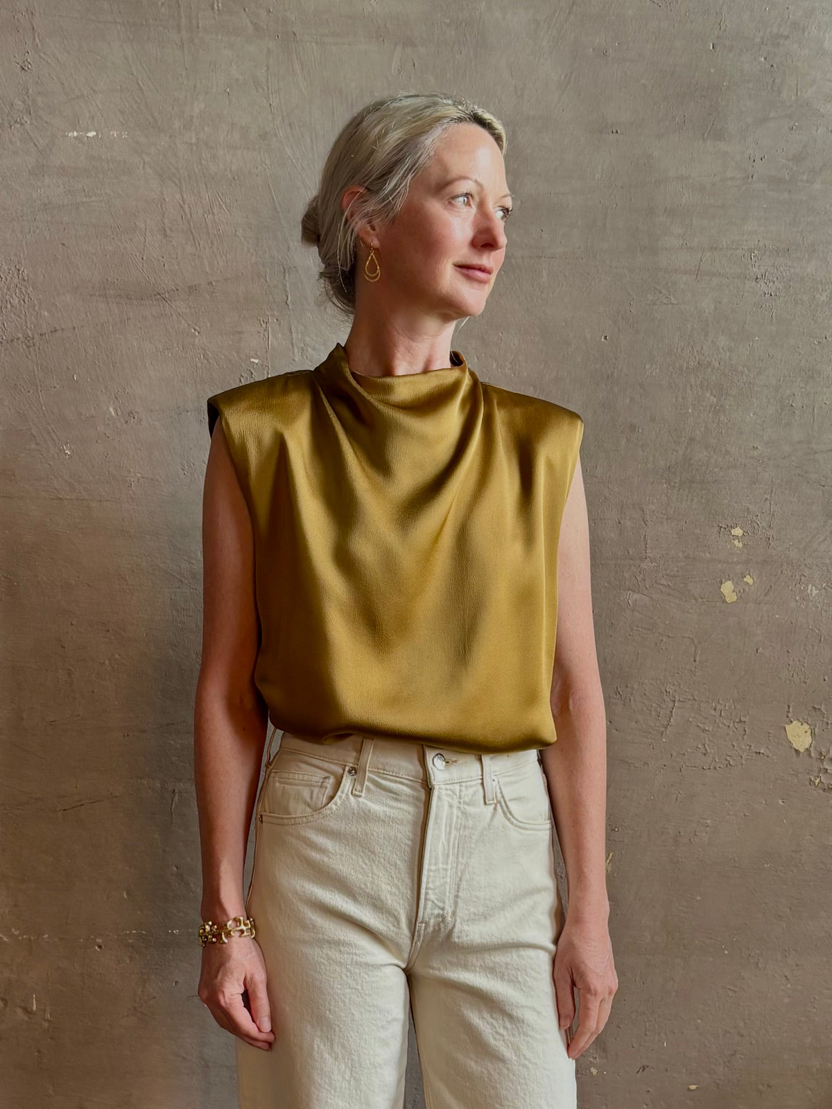 woman wearing luxury Italian designer FORTE FORTE Envers Satin Crater-Neck sleeveless Shirt matte Antique Gold 