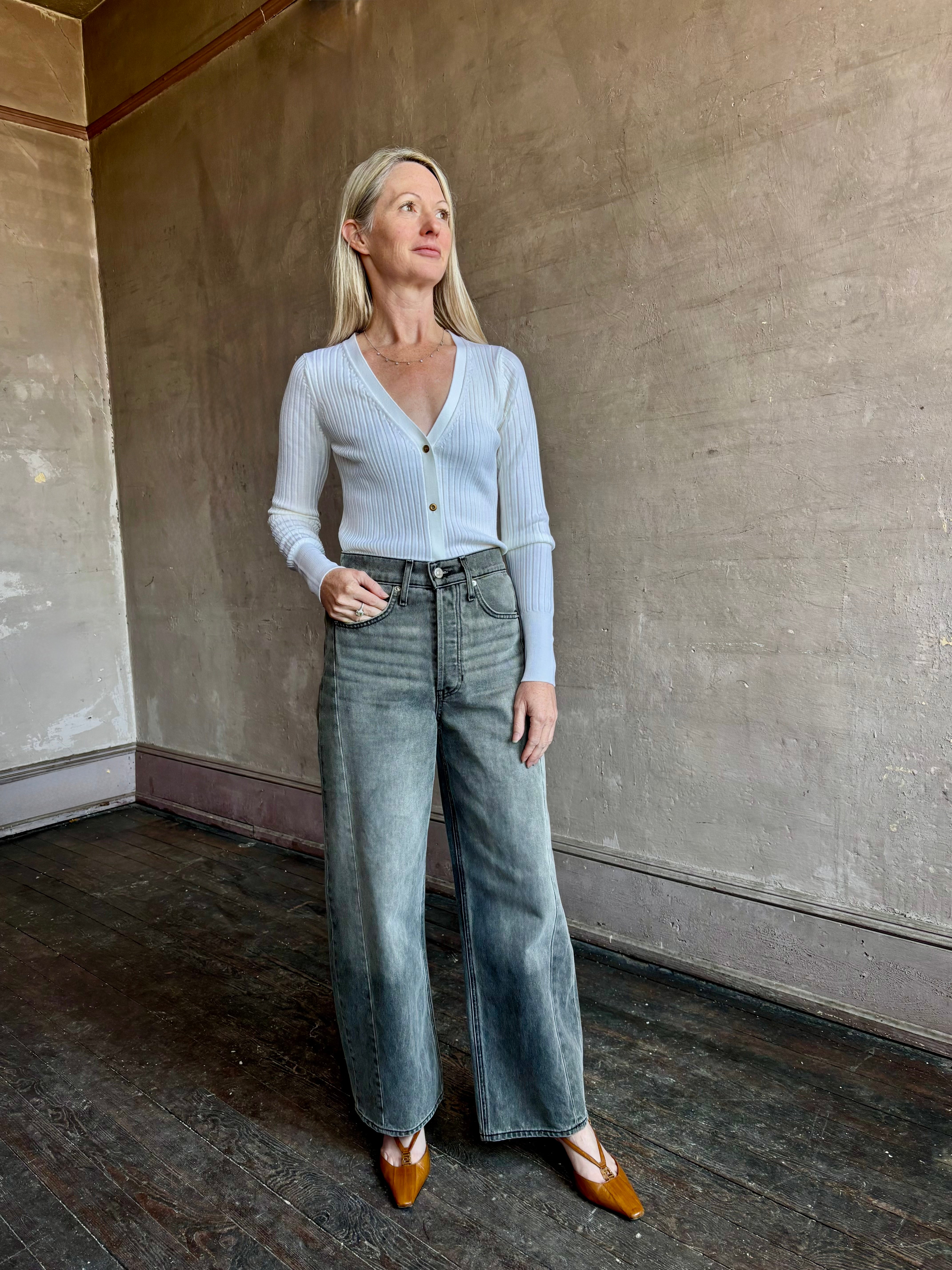 Image of woman wearing Italian knitwear by FORTE FORTE Superfine Merino Ribbed Cardigan in Neve off-white with v-neck and long sleeves