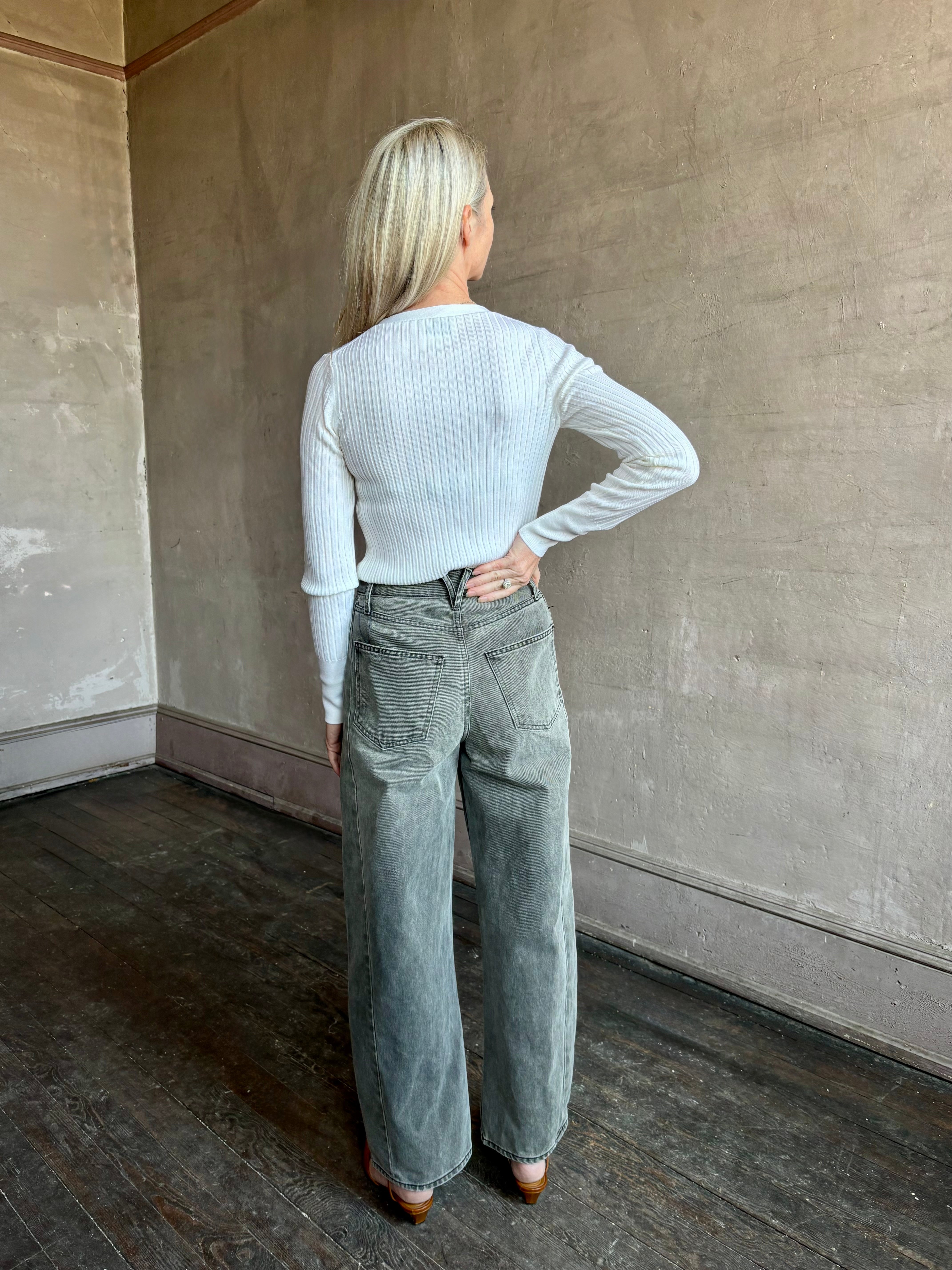 Image of woman wearing Italian knitwear by FORTE FORTE Superfine Merino Ribbed Cardigan in Neve off-white with v-neck and long sleeves