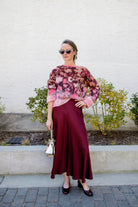 Image featuring a woman wearing the bloom mist mohair and alpaca sweater by Forte Forte with a crew neckline and slightly boxy fit in cerise multicolor floral print.