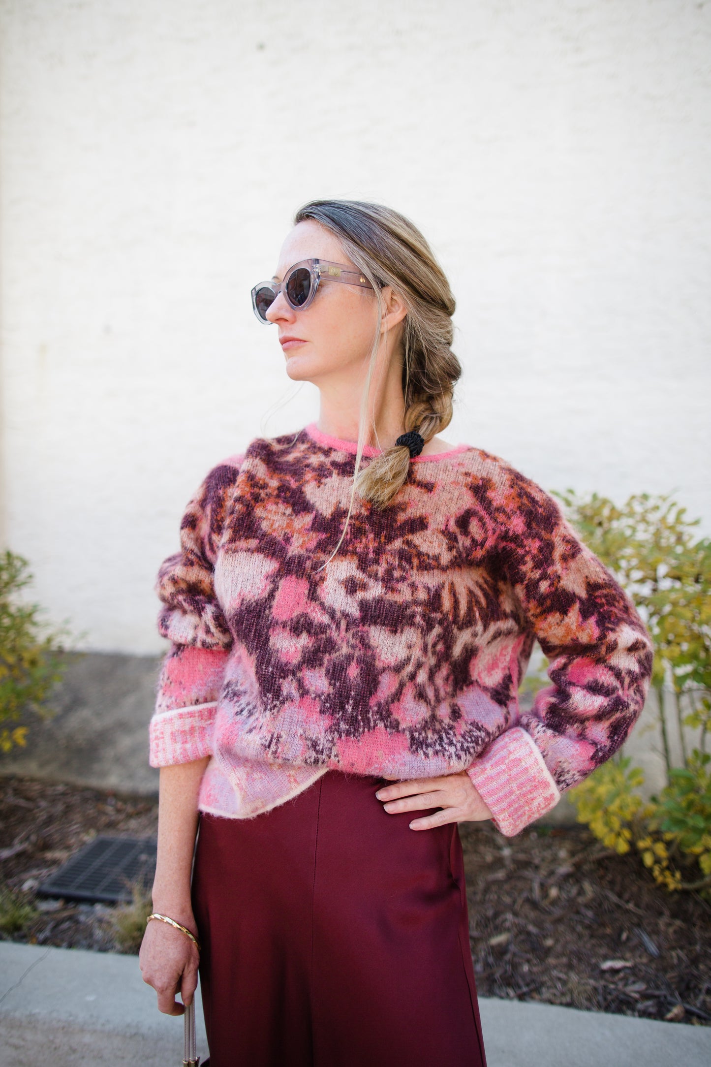 Image featuring a woman wearing the bloom mist mohair and alpaca sweater by Forte Forte with a crew neckline and slightly boxy fit in cerise multicolor floral print.