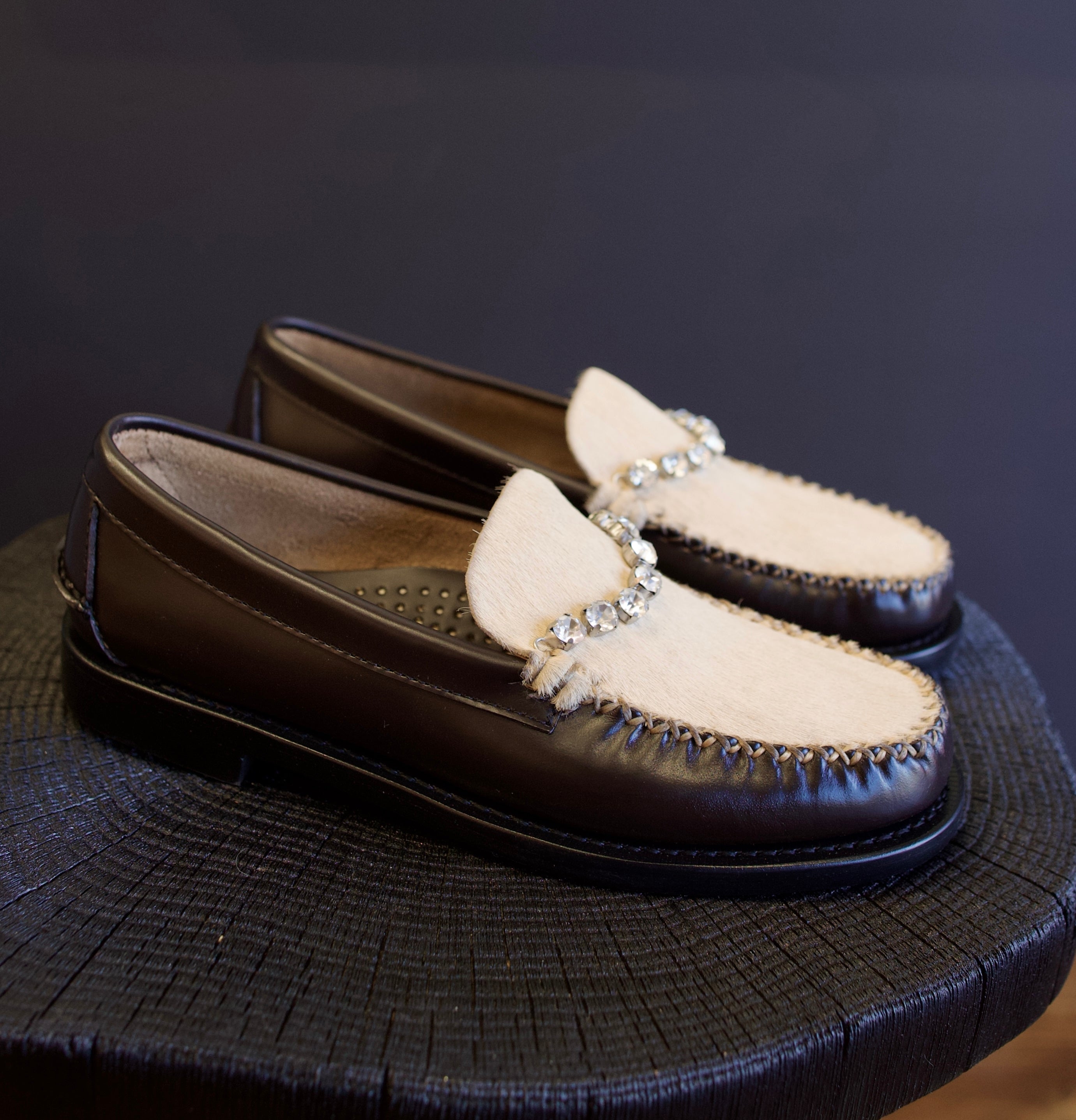 Image featuring the Forte Forte collaboration loafers with Sebago. They are brown leather with ivory horsehair accents and rhinestone detailing.