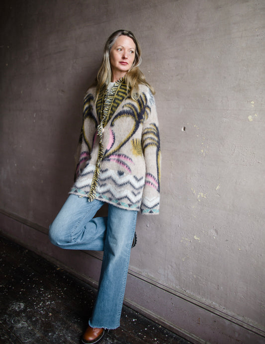 Image of a woman wearing the Forte Forte Sacred Forest Cardigan and the Slvrlake Grace Jeans in separate ways.