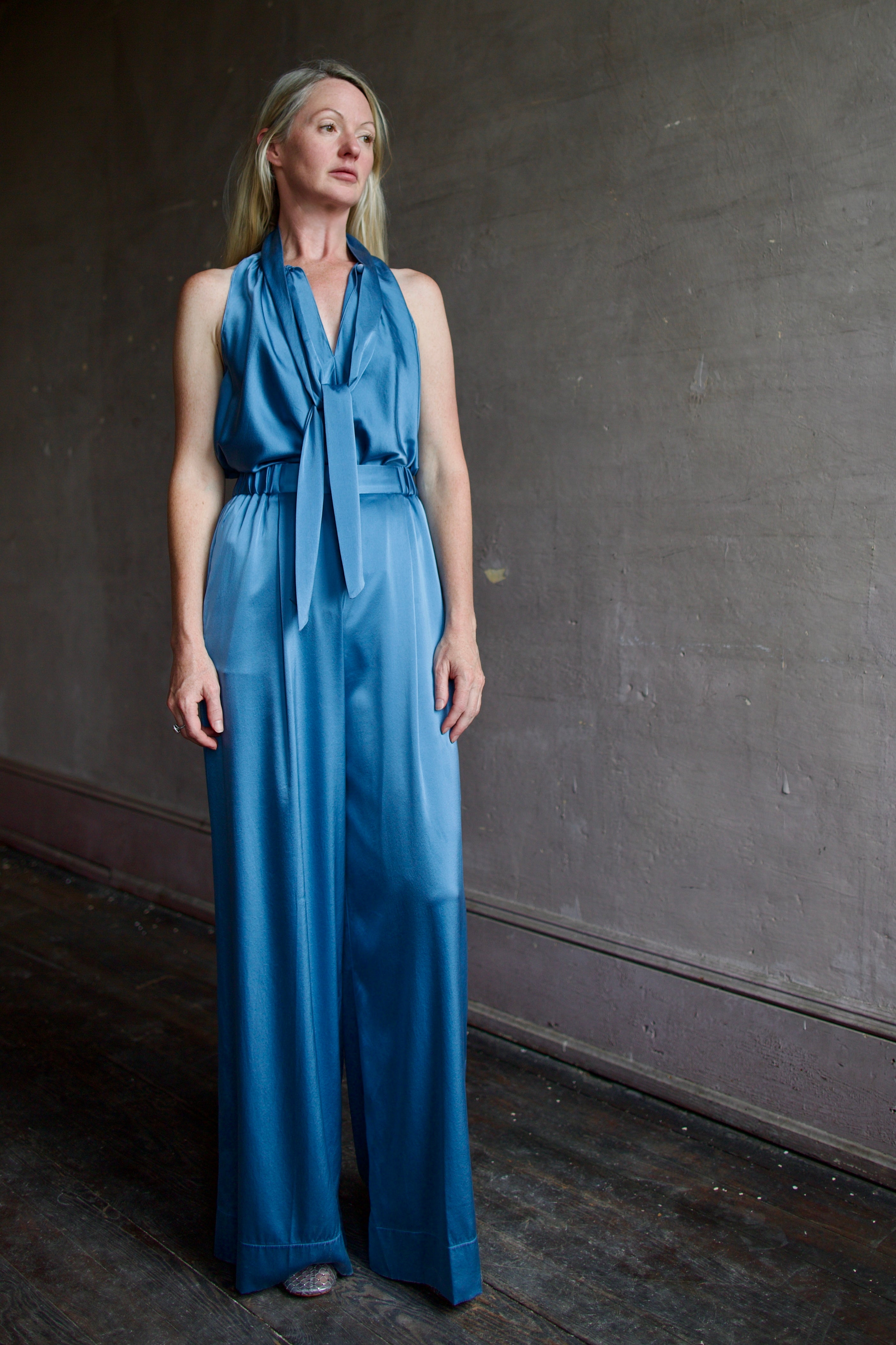 Model wearing high-end designer Forte Forte blue silk sleeveless top and pant set 