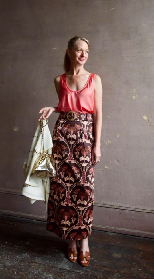 image of a woman wearing the Forte Forte tank and Cara Cara Printed Skirt
