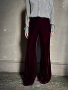Close up of Forte_Forte Plain Velvet Flare Pants in Burgundy fitted flat front with tailored waistband fluid leg full length consealed side seam zipper