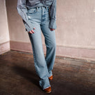 Image featuring a woman wearing the Frame denim Le Jane - ultra-high-rise jean in weston rips wash.