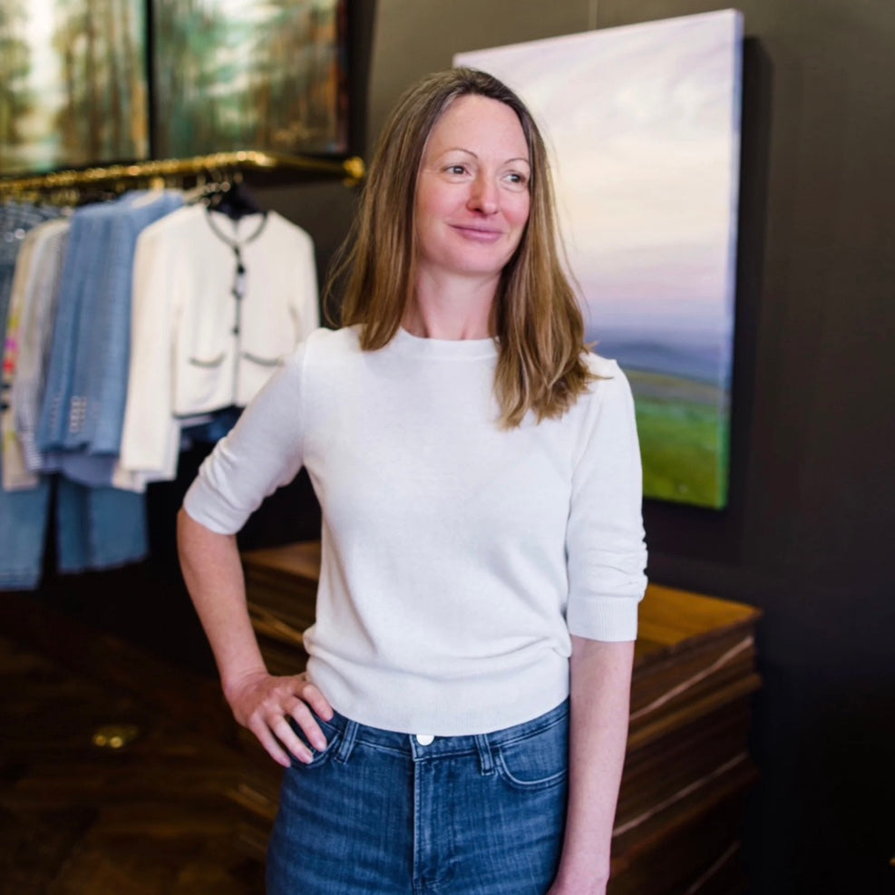 Image featuring a woman wearing a Frame short sleeve crew neck sweater with rushed sleeves and bottom band.