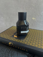 A dark bottle of Fulton and Roark extrait de parfum 226 CLUB with woody, aromatic, tonic and orange bitters scent designed to evoke a 1920's Chicago speakeasy