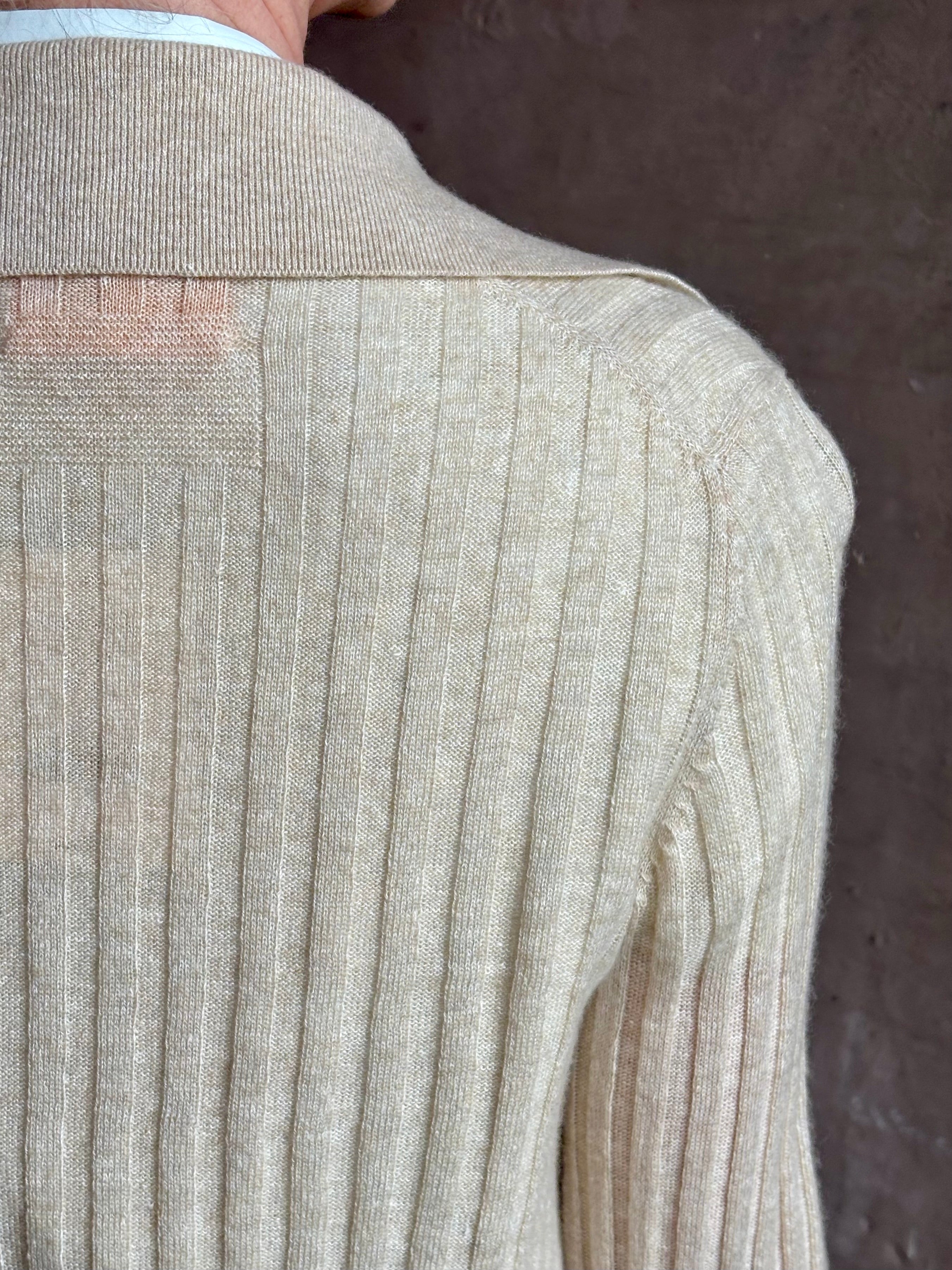 Image of mature woman wearing premium cashmere linen GUEST IN RESIDENCE Breezy Cardigan in Sandstone beige with long sleeves hook and eye front closure and ribbed texture