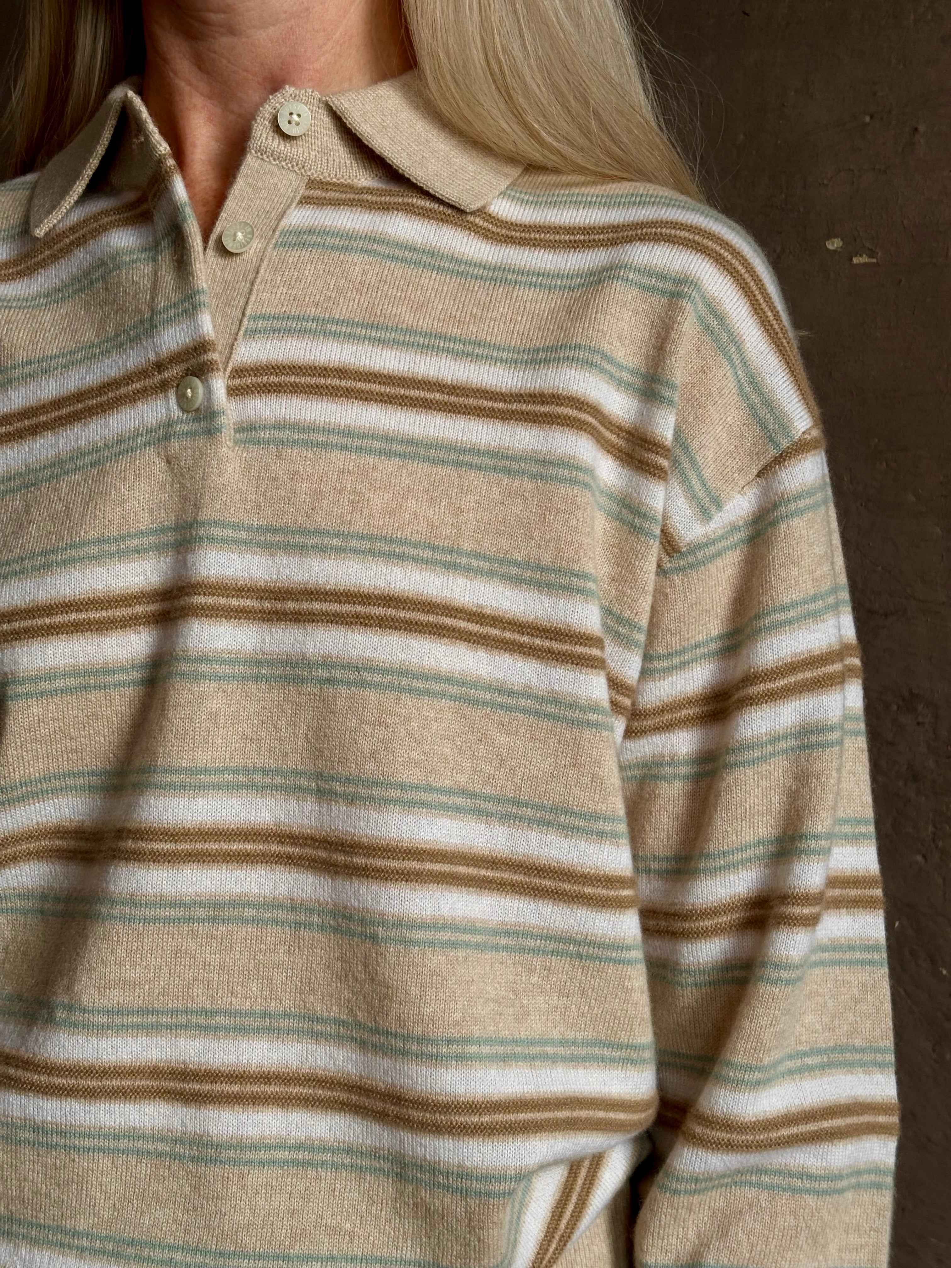 Mature woman wearing Guest in Residence Colliegate beige aqua and white striped cashmere polo sweater