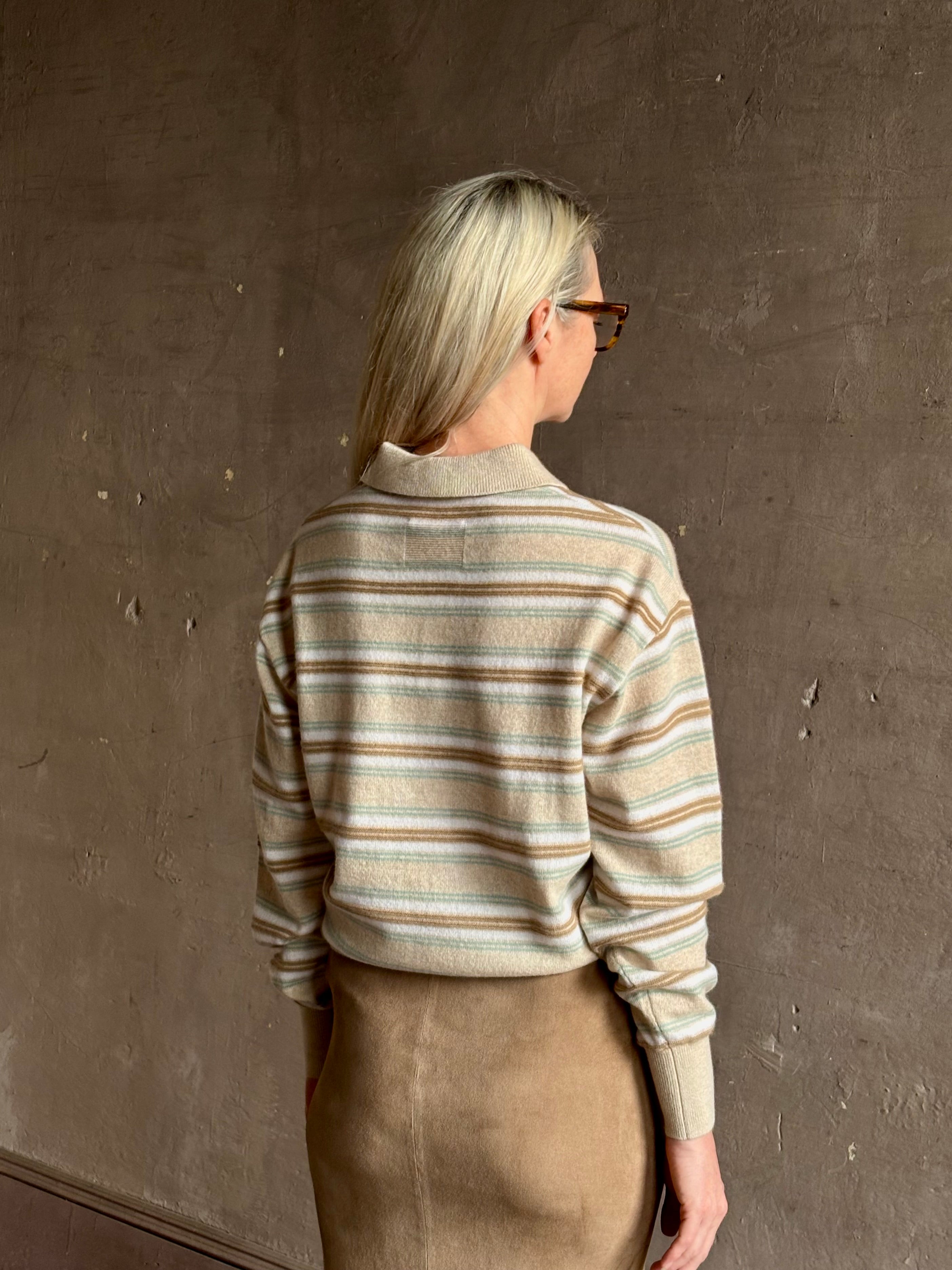 Mature woman wearing Guest in Residence Colliegate beige aqua and white striped cashmere polo sweater