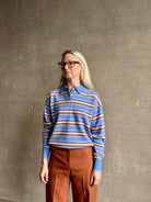 Mature woman wearing Guest in Residence Colliegate Delft Blue sienna yellow striped cashmere polo sweater