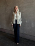 Mature woman wearing Guest in Residence Dylan Tweed Shirt in Sandstone Mongolian cashmere button front front breast pocket collared