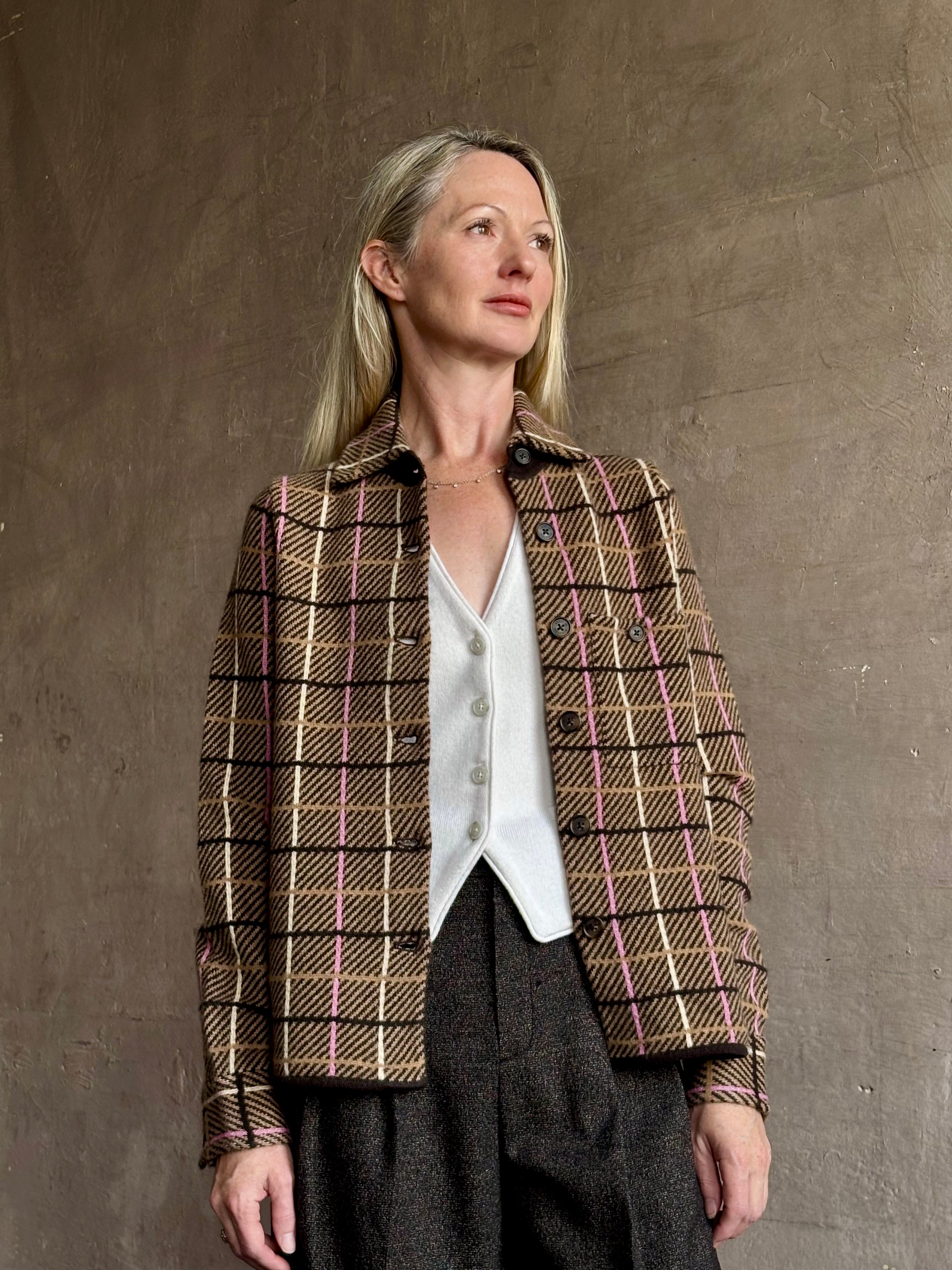 Image of mature woman wearing luxurious cashmere with versatile layering functionality from New York clothing designer Guest In Residence