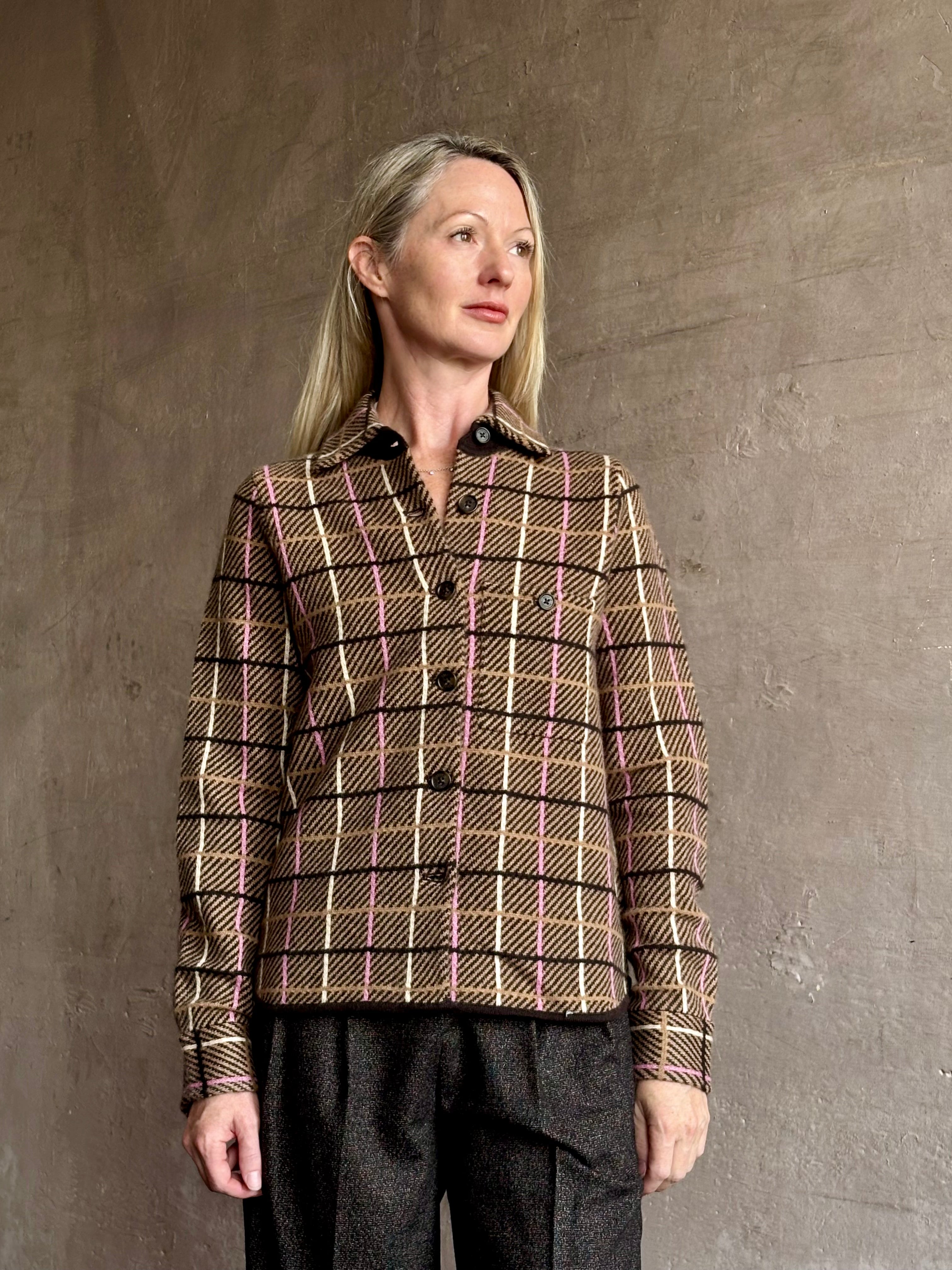 Image of mature woman wearing a sophisticated plaid pattern cashmere shirt with rustic refinement by American luxury brand Guest In Residence