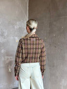 mature woman wearing luxury American clothing designer Guest in Residence plaid Button-Down Long Sleeve Collared Dylan cashmere shirt