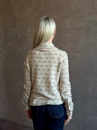 Mature woman wearing Guest in Residence Dylan Tweed Shirt in Sandstone Mongolian cashmere textural Heirloom-quality workwear-inspired overshirt