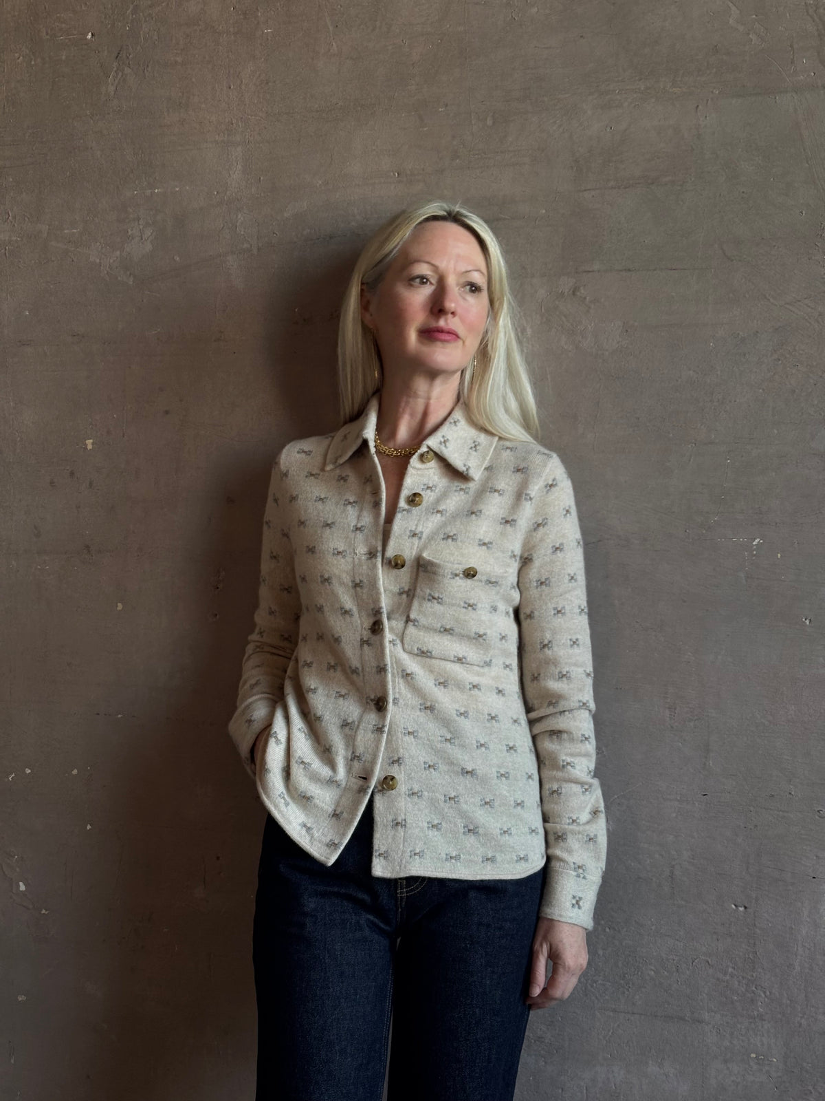 Mature woman wearing Guest in Residence Dylan Tweed Shirt in Sandstone Mongolian cashmere textural tweed finish. Heirloom-quality workwear-inspired overshirt