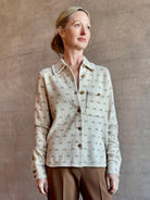 Image of woman wearing luxury designer GUEST IN RESIDENCE Dylan Tweed Shirt in Sandstone Combo in neutral tweed print