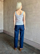 Image of woman wearing lightweight premium Mongolian cashmere GUEST IN RESIDENCE Fine Stripe sleeveless Tank in red and blue stipes with round neckline