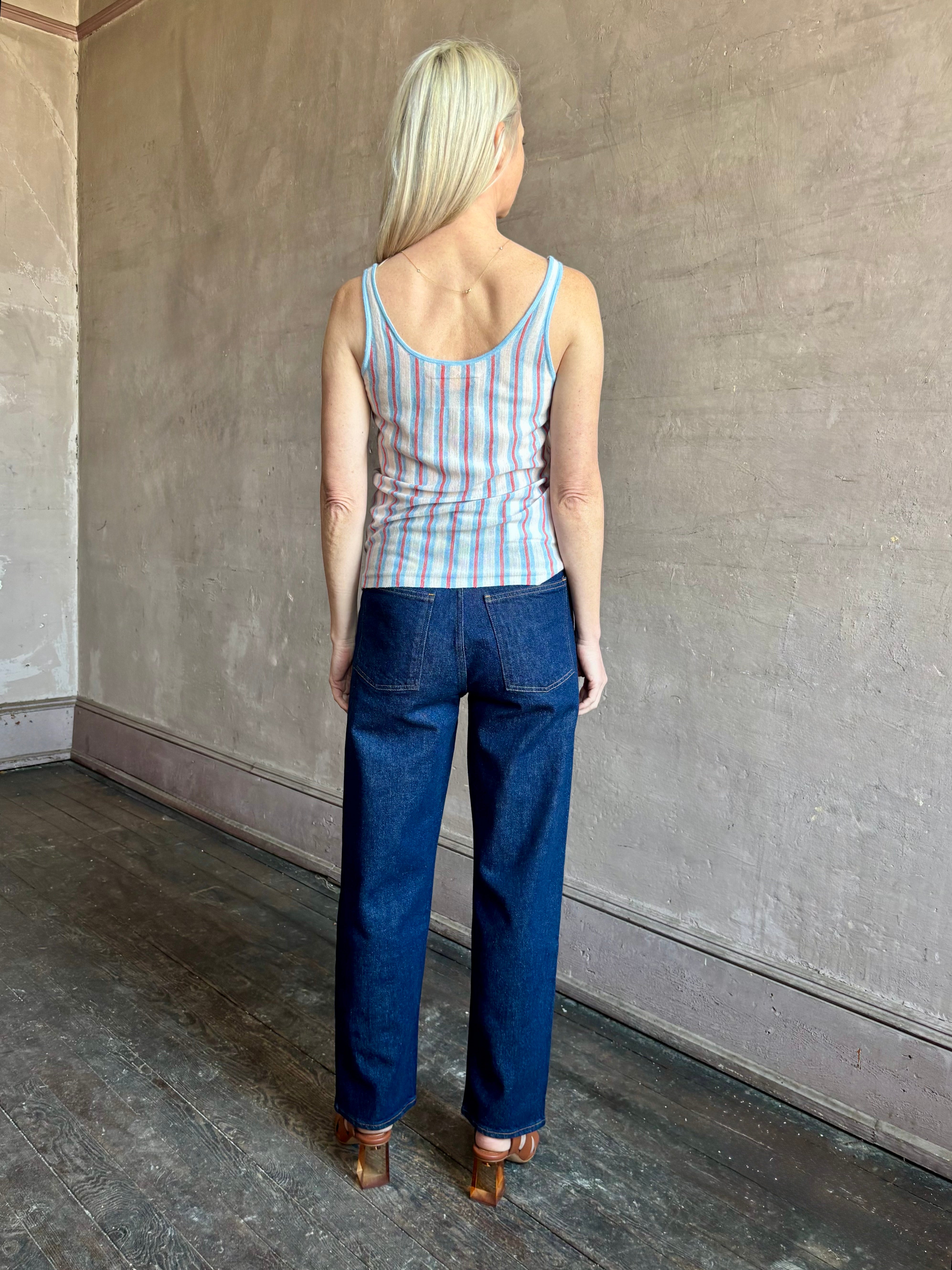 Image of woman wearing lightweight premium Mongolian cashmere GUEST IN RESIDENCE Fine Stripe sleeveless Tank in red and blue stipes with round neckline