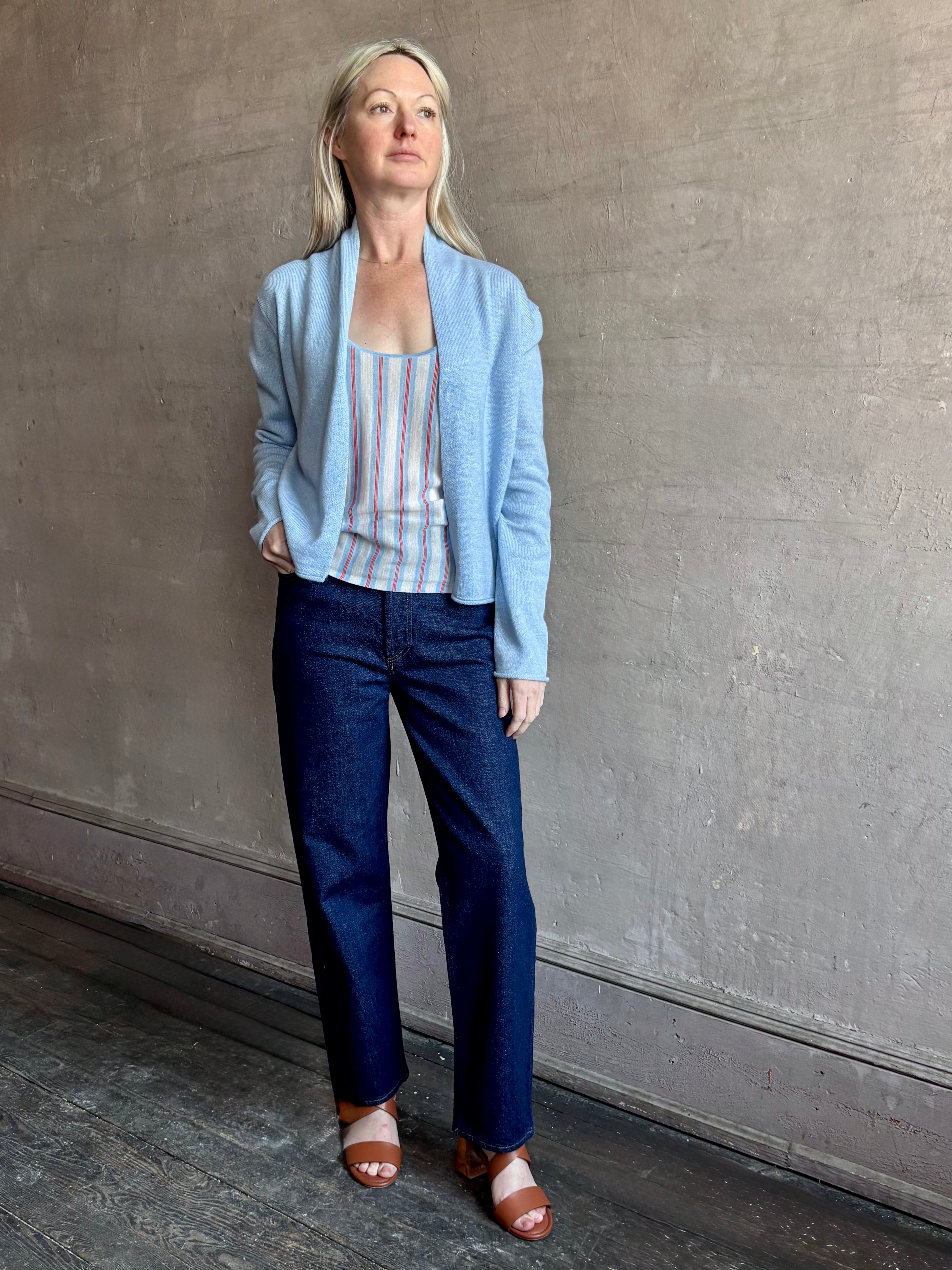 Image of woman wearing lightweight premium Mongolian cashmere GUEST IN RESIDENCE Fine Stripe sleeveless Tank in red and blue stipes with round neckline
