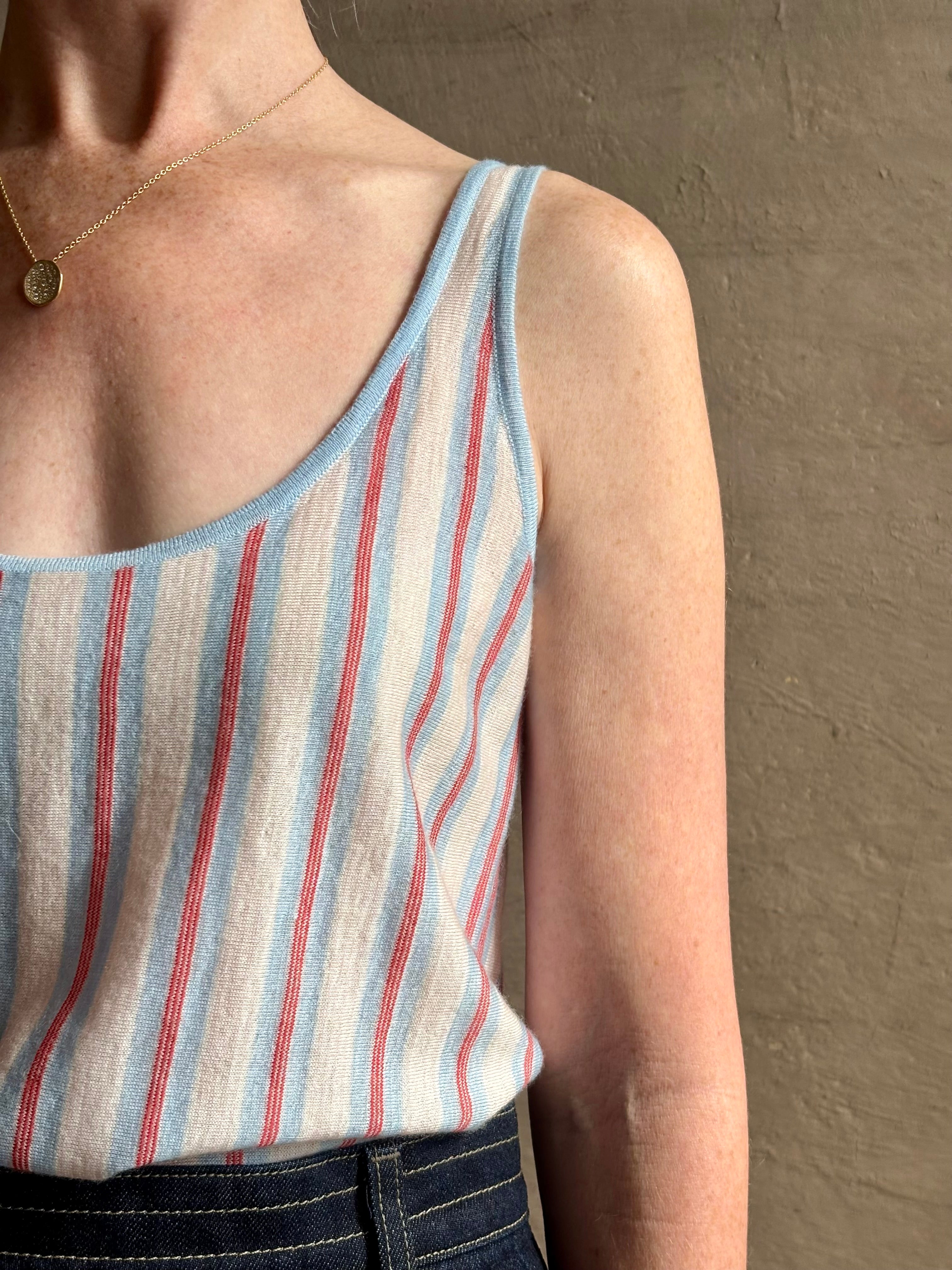 Image of woman wearing lightweight premium Mongolian cashmere GUEST IN RESIDENCE Fine Stripe sleeveless Tank in red and blue stipes with scoop neck