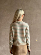 Mature woman wearing Guest in Residence Pebble cream and sage stripe shrunken crew long sleeve cashmere knit
