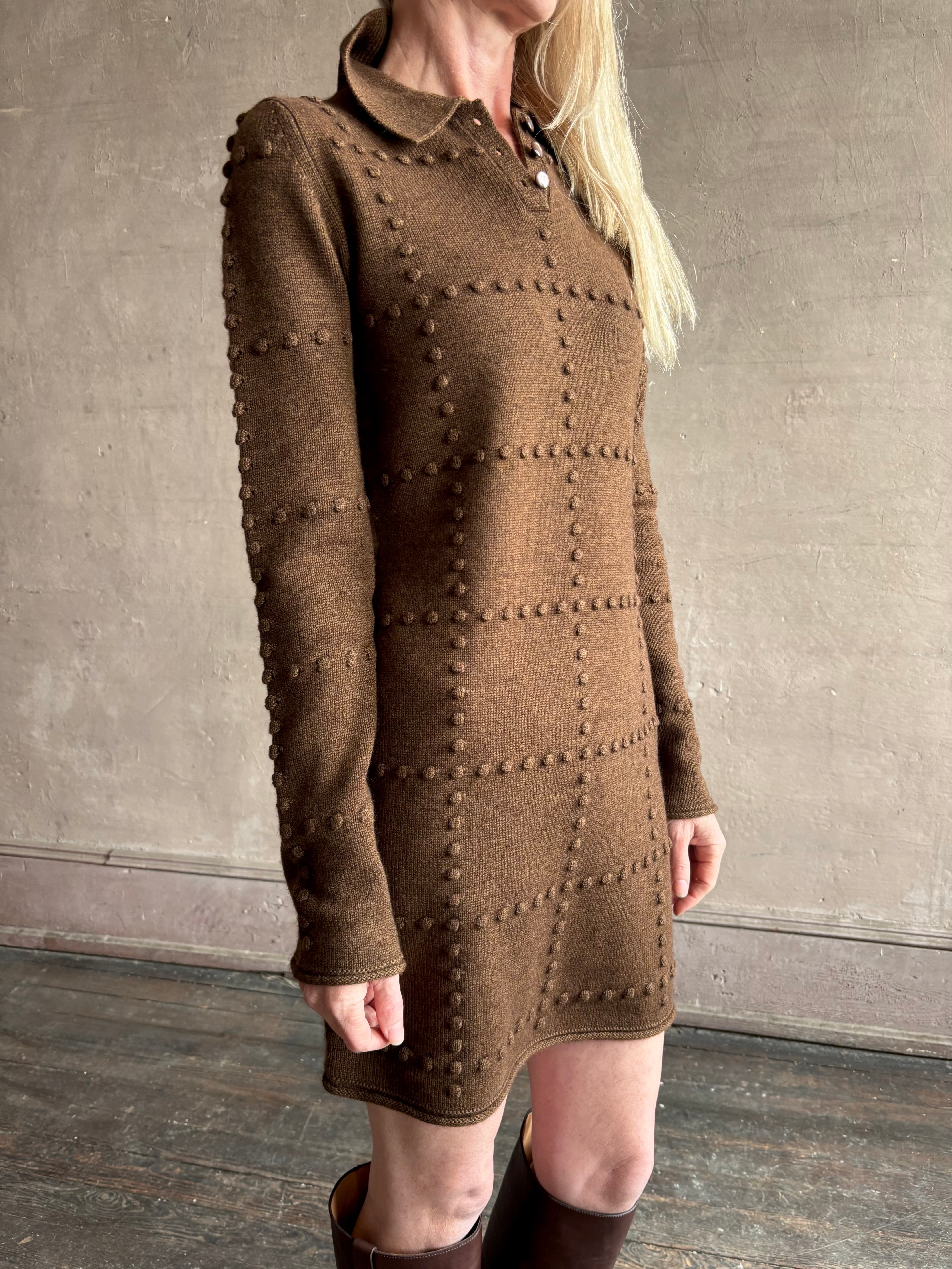 Image of mature woman wearing celebrity brand Guest in Residence Popcorn Polo long sleeve brown mini dress with a geometric patterned texture