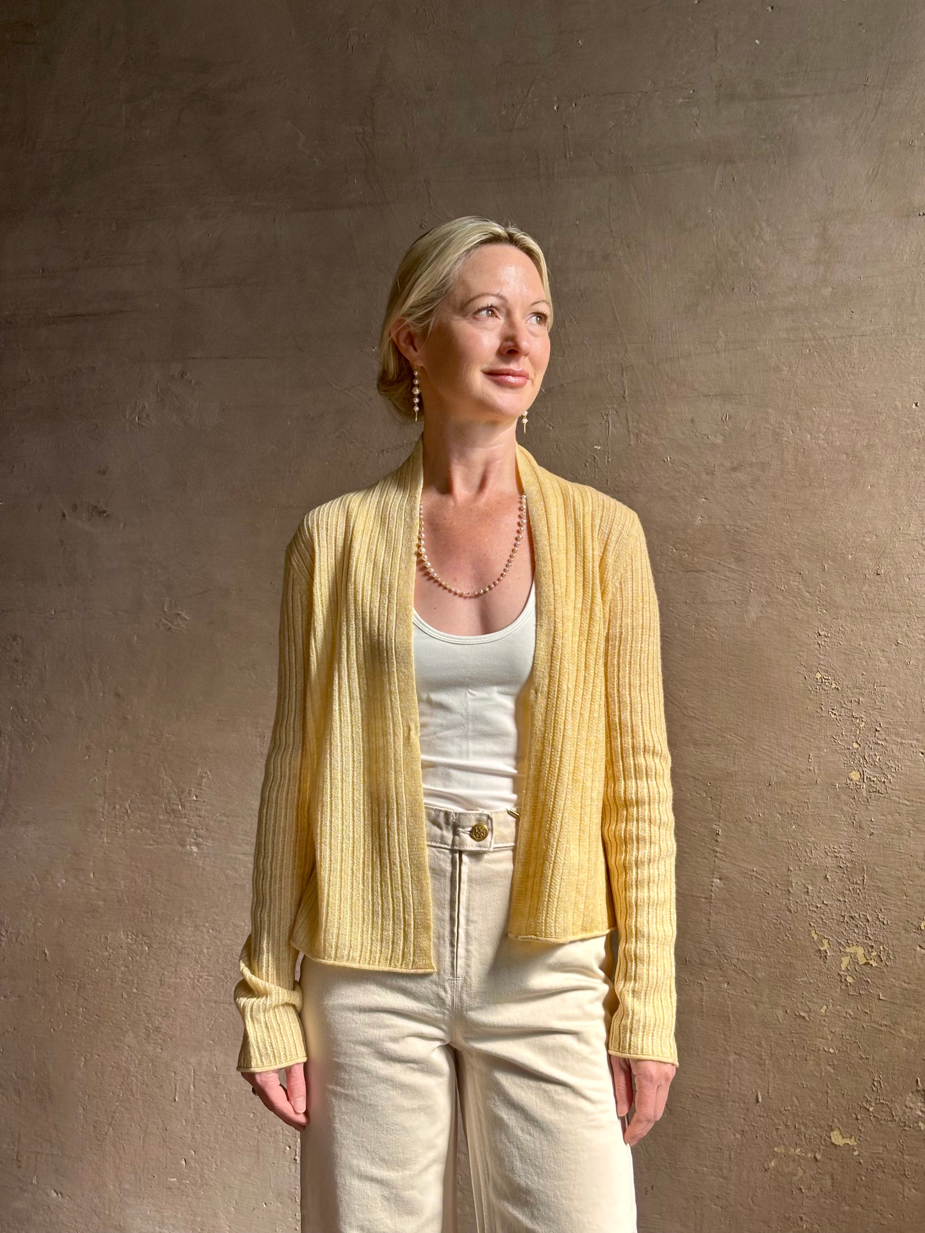 Mature woman wearing Guest in Residence Rib Stealth Cardigan layering essential in butter yellow cashmere linen blend