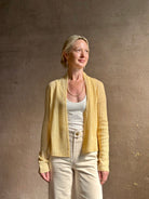 Mature woman wearing Guest in Residence Rib Stealth Cardigan layering essential in butter yellow cashmere linen blend