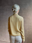 Mature woman wearing Guest in Residence Rib Stealth Cardigan layering essential in butter yellow cashmere linen blend