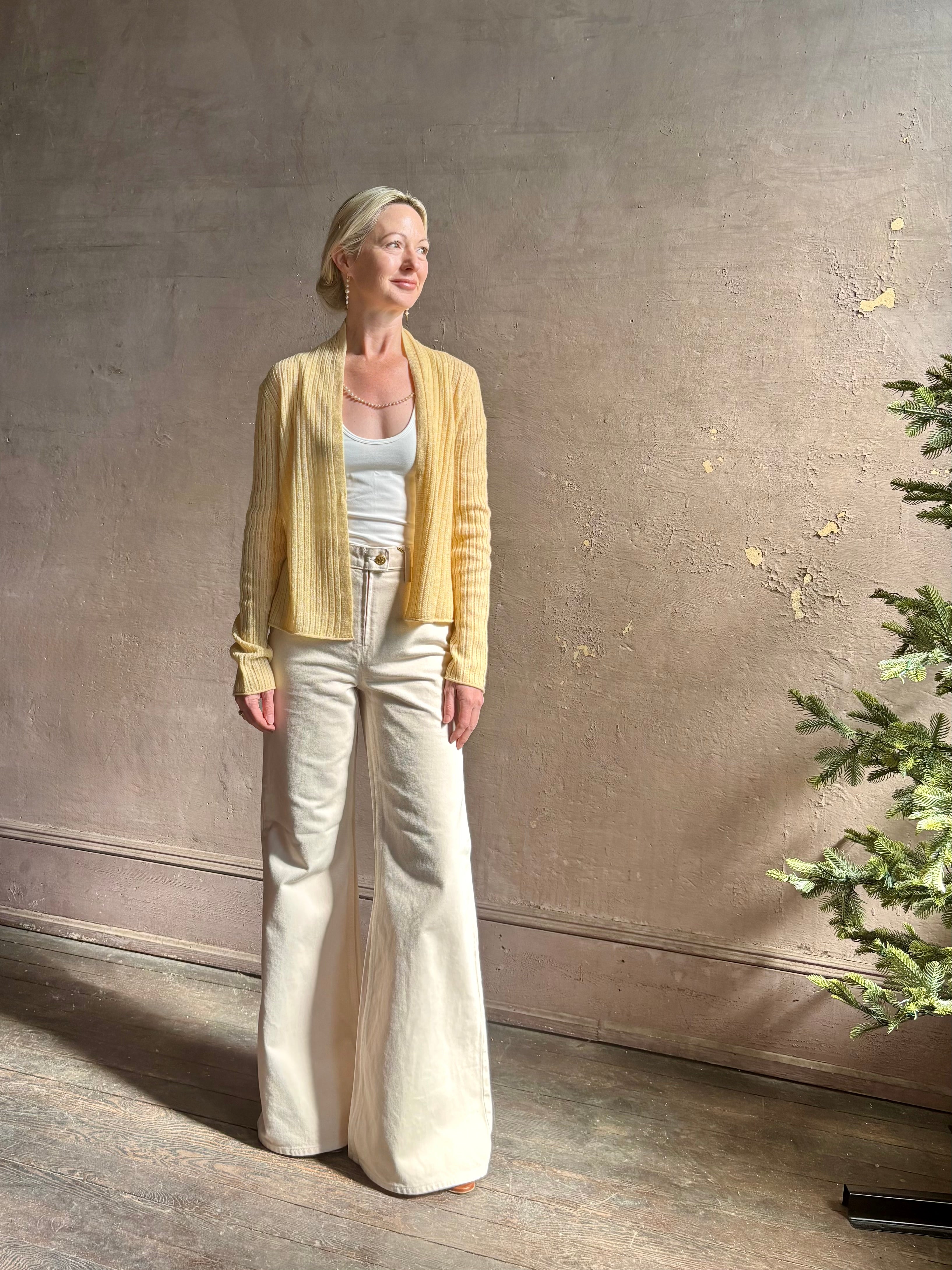 Mature woman wearing Guest in Residence Rib Stealth Cardigan layering essential in butter yellow cashmere linen blend