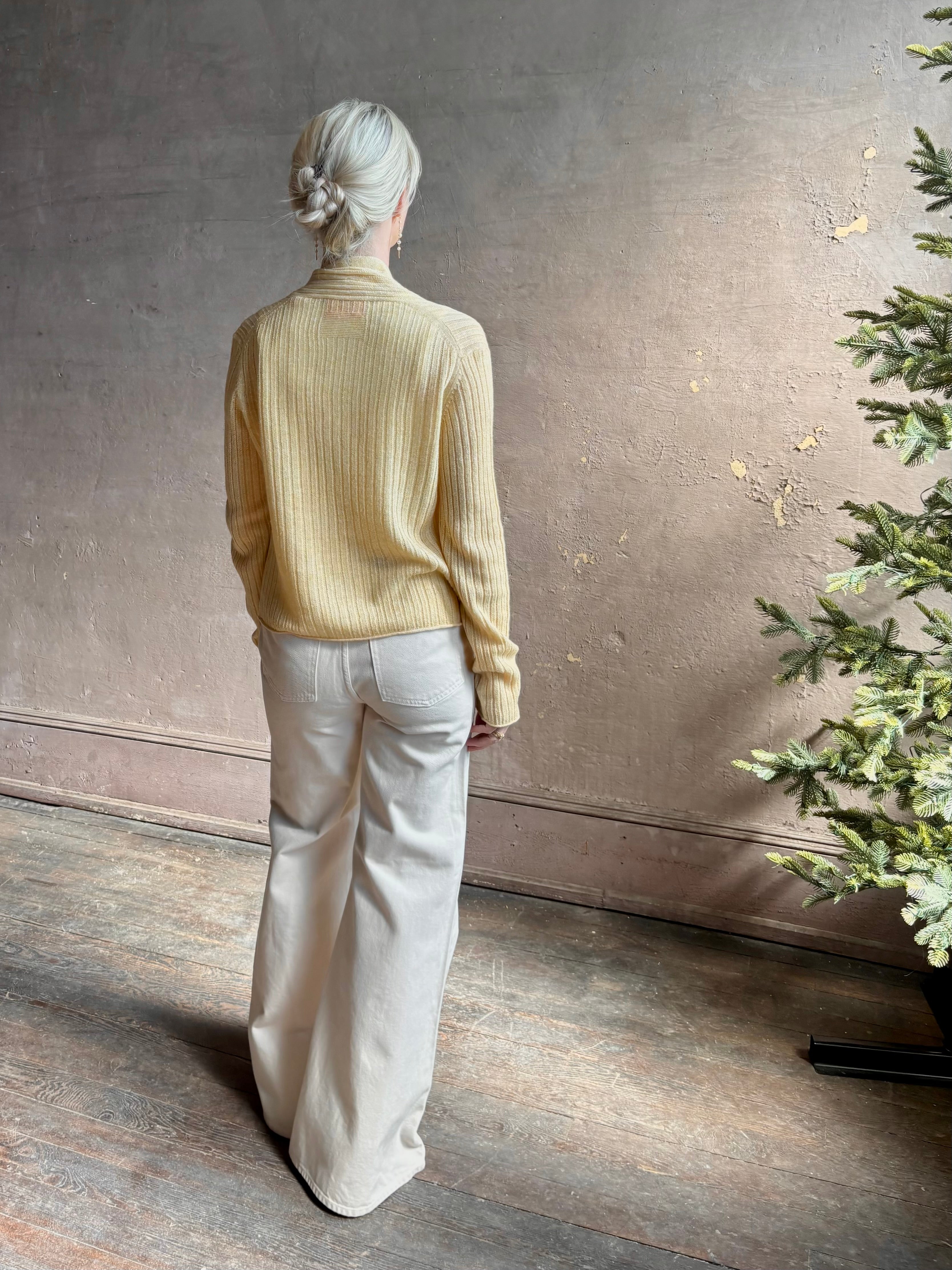 Mature woman wearing Guest in Residence Rib Stealth Cardigan layering essential in butter yellow cashmere linen blend