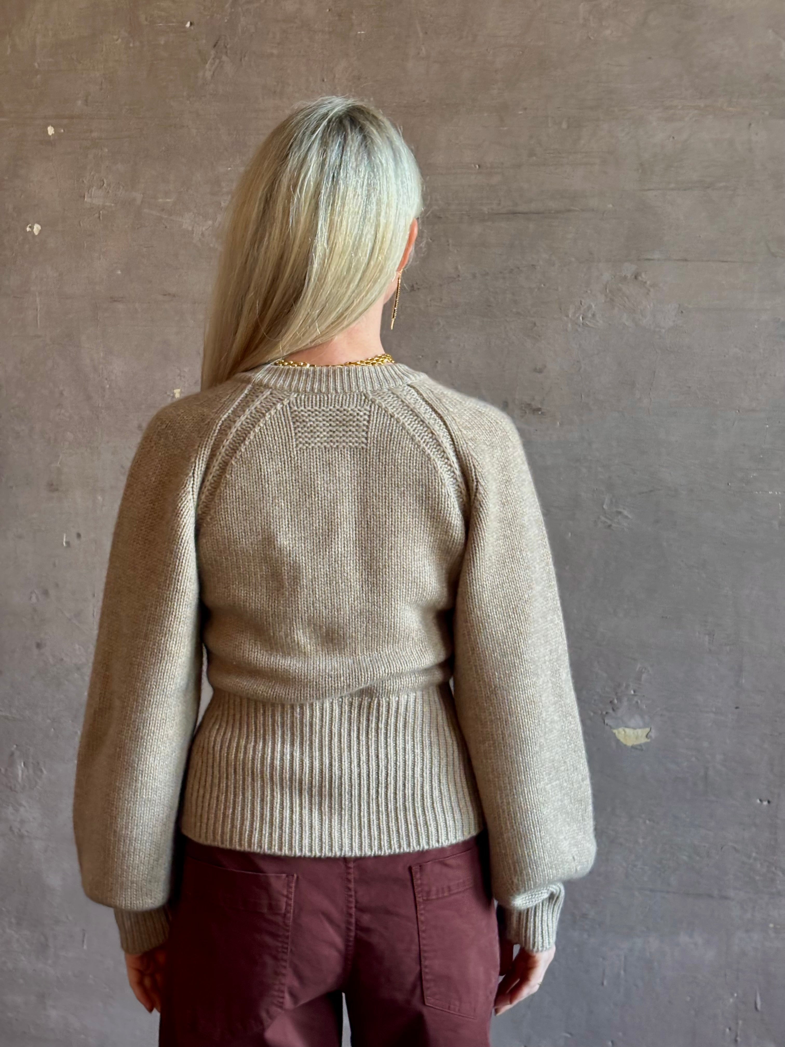 Mature woman wearing Guest in Residence Sculpted Cardigan in Taupe medium gauge cashmere raglan sleeves button front fitted waist softly structured
