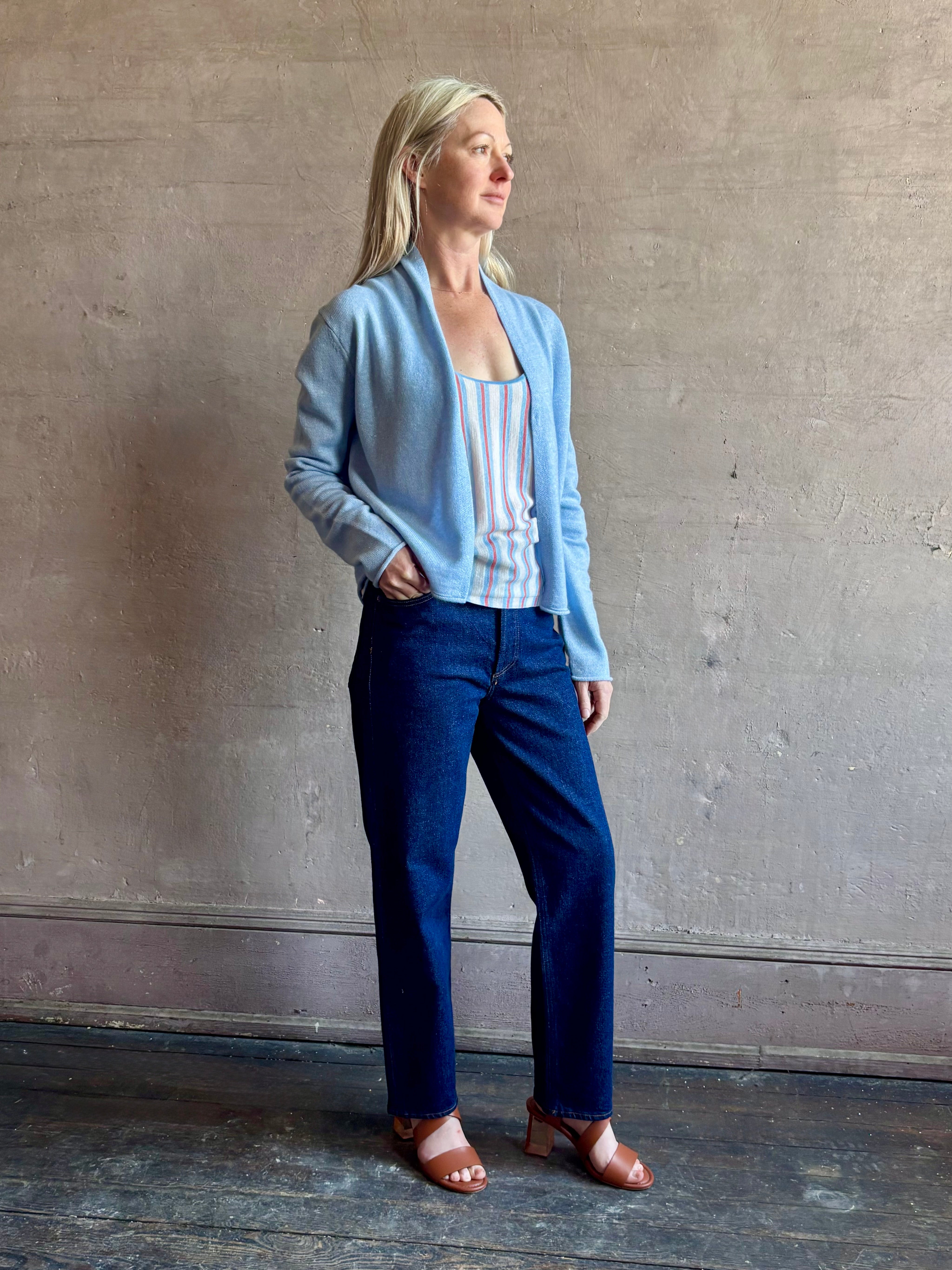 Image of woman wearing comfortable Clear Sky blue Guest in Residence Stealth cashmere linen lightweight Cardigan with long sleeves and open front with single hook and eye closure