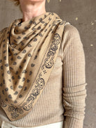 Detail of cotton silk Guest in Residence The Wild Rag camel brown patterned bandana triangle reversible scarf