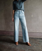 Image featuring a woman wearing the Grace Ankle jeans by Slvrlake with a high rise, wide leg and an ankle length fit in heartache wash.