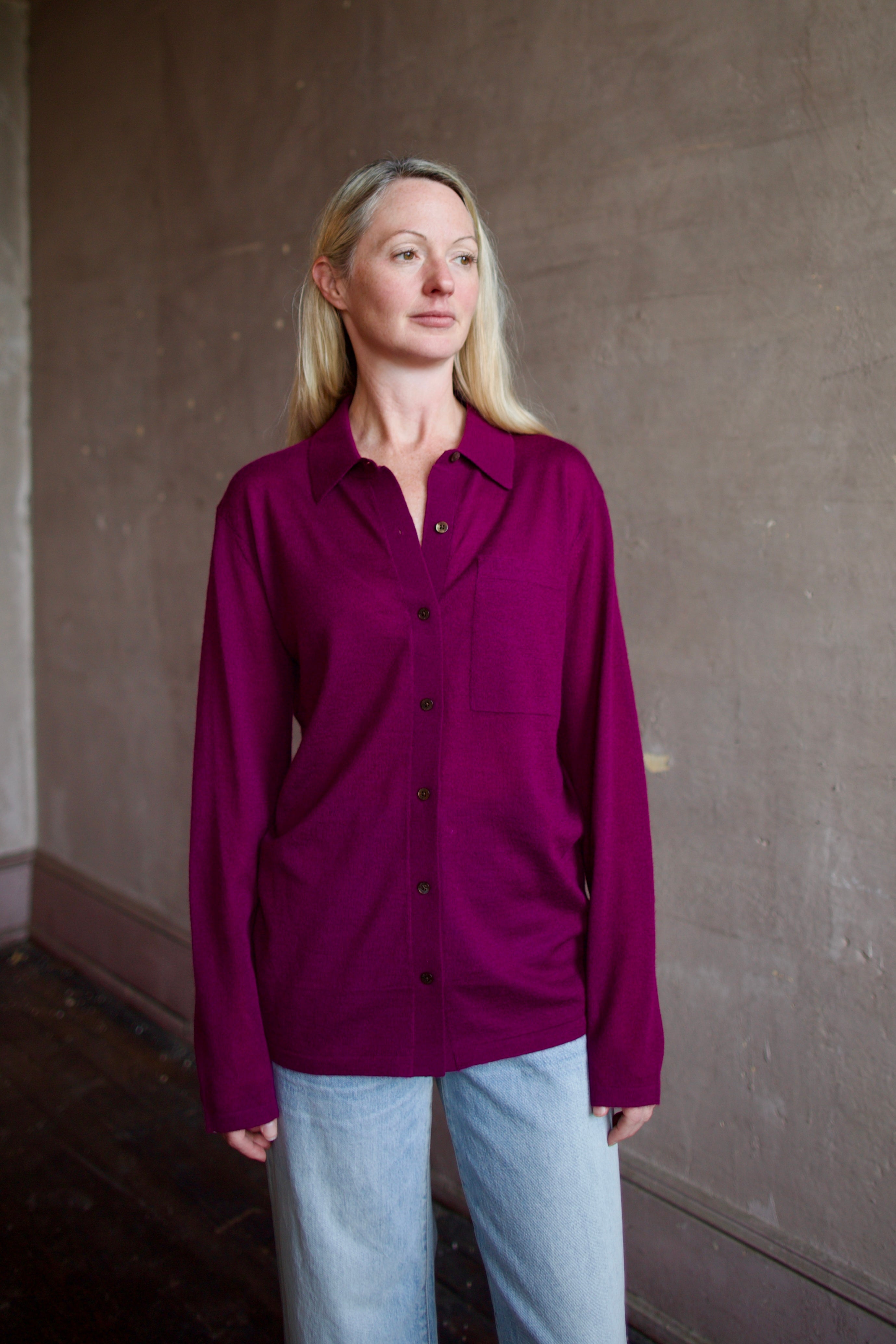 Model wearing the designer Guest In Residence Showtime shirt in Aubergine button up premium cashmere long sleeve shacket 